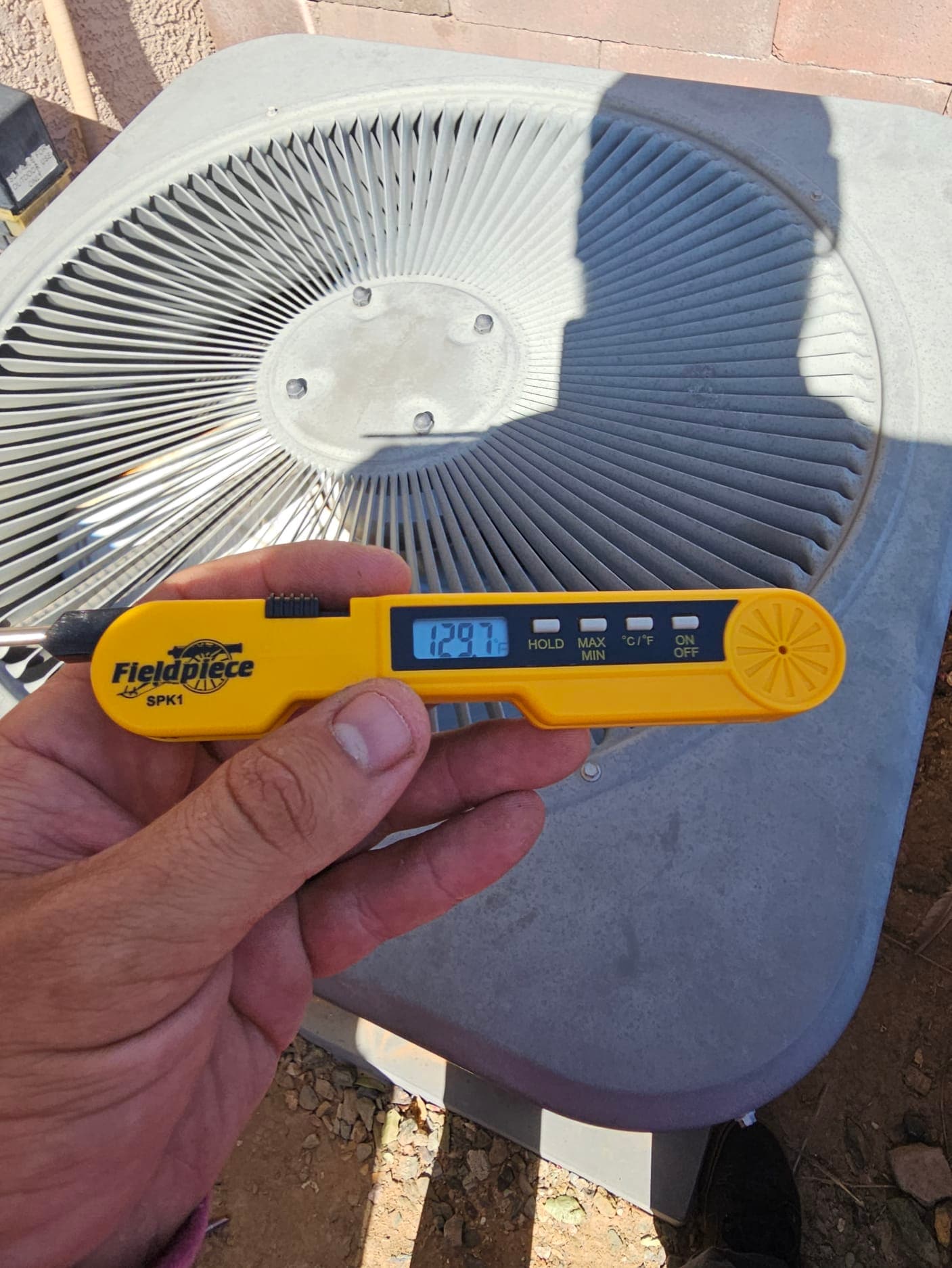 HVAC diagnostic instrument photographed during the service visit.