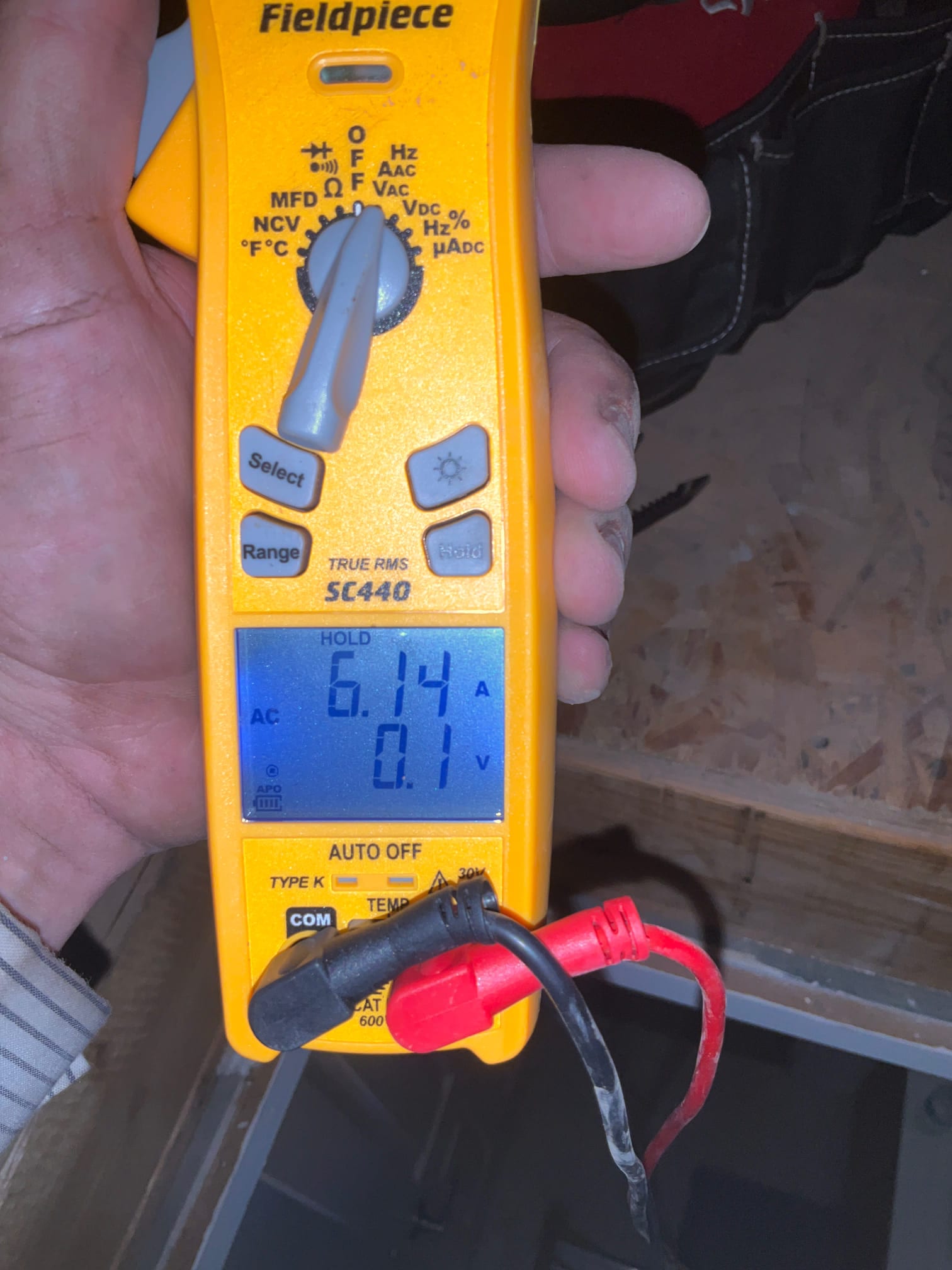 HVAC diagnostic instrument photographed during the service visit.