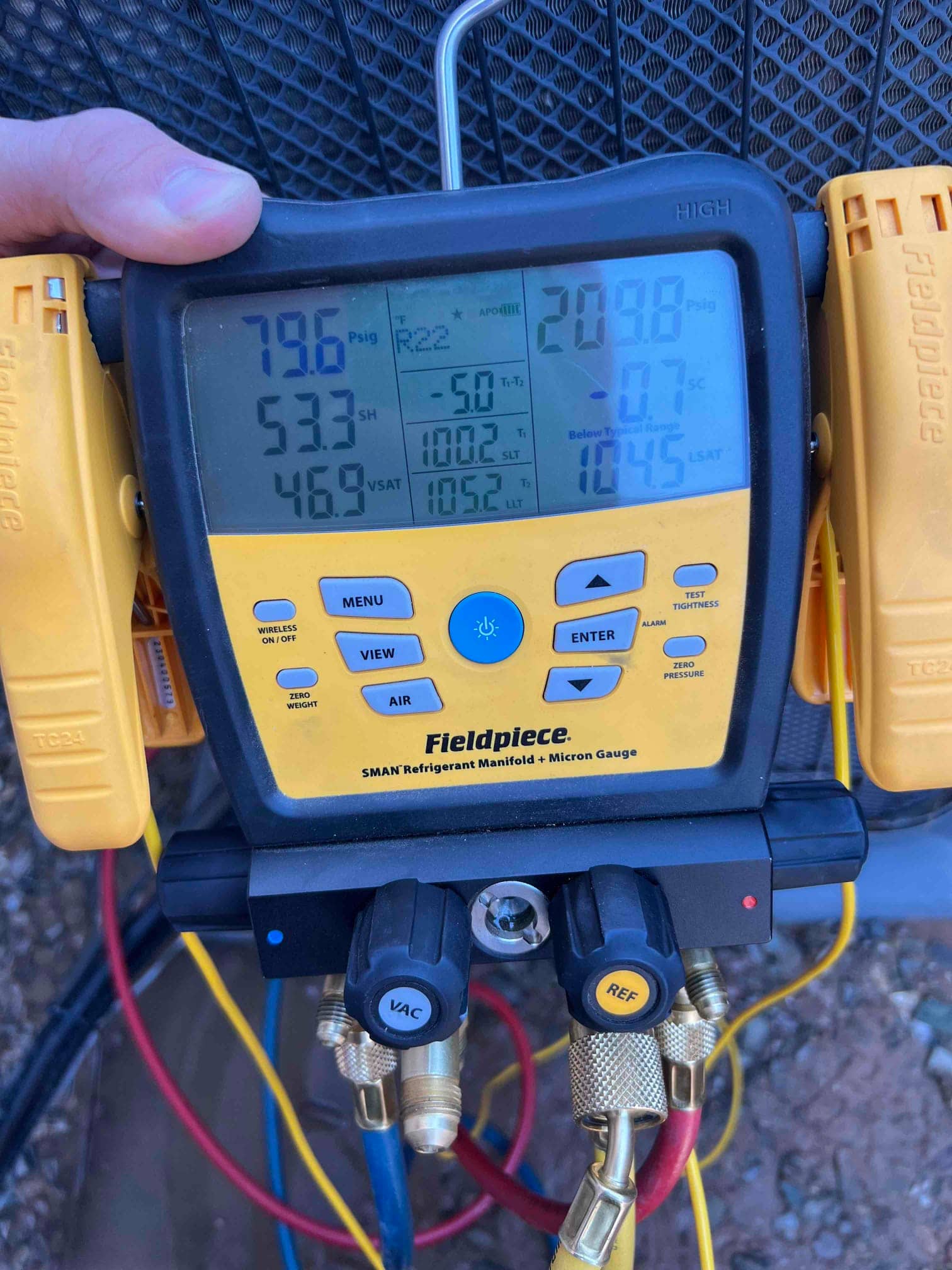 HVAC diagnostic instrument photographed during the service visit.