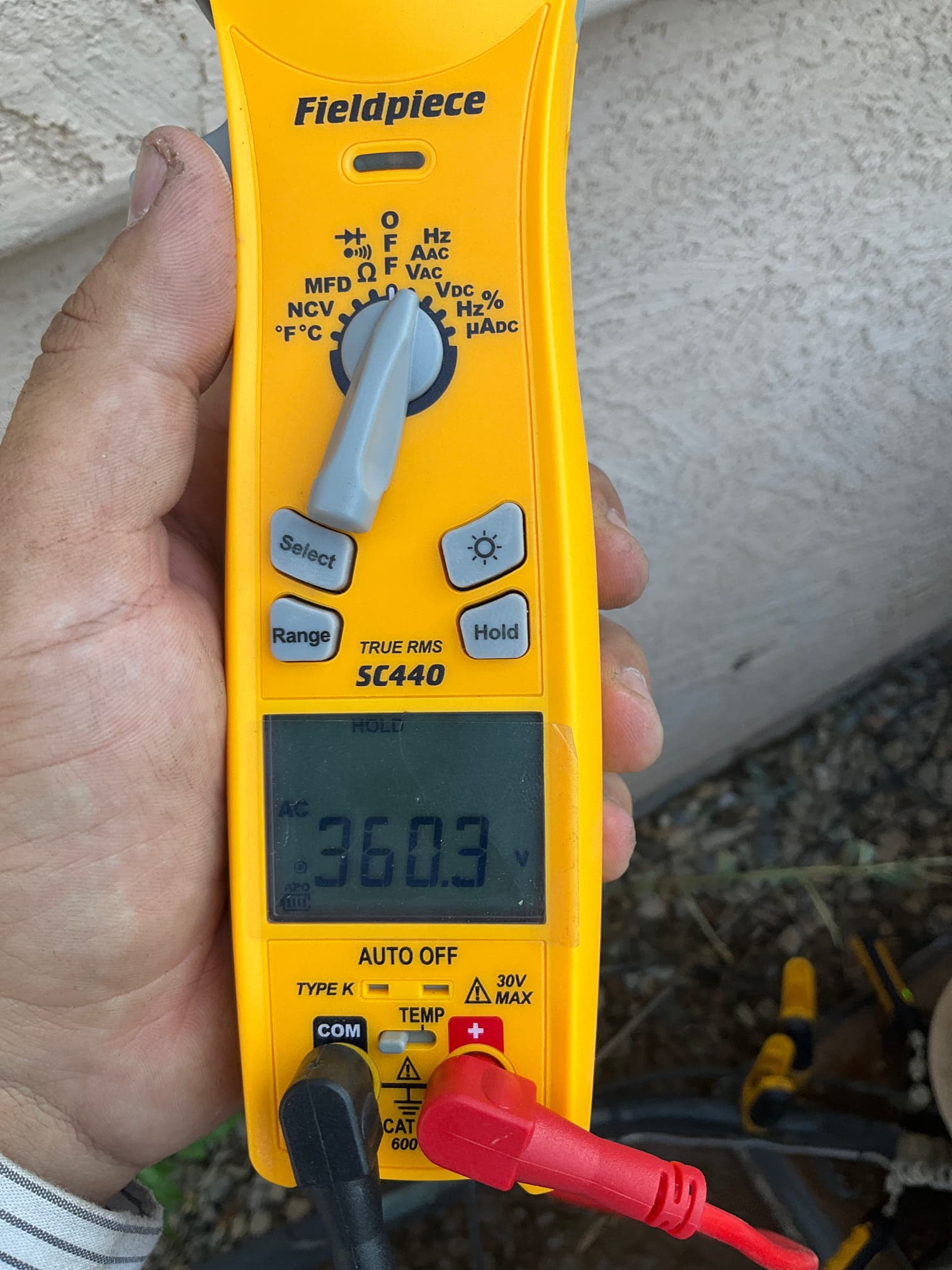 HVAC diagnostic instrument photographed during the service visit.