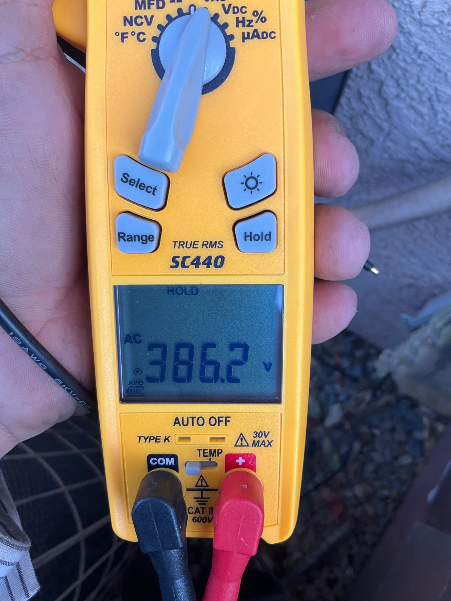 HVAC diagnostic instrument photographed during the service visit.