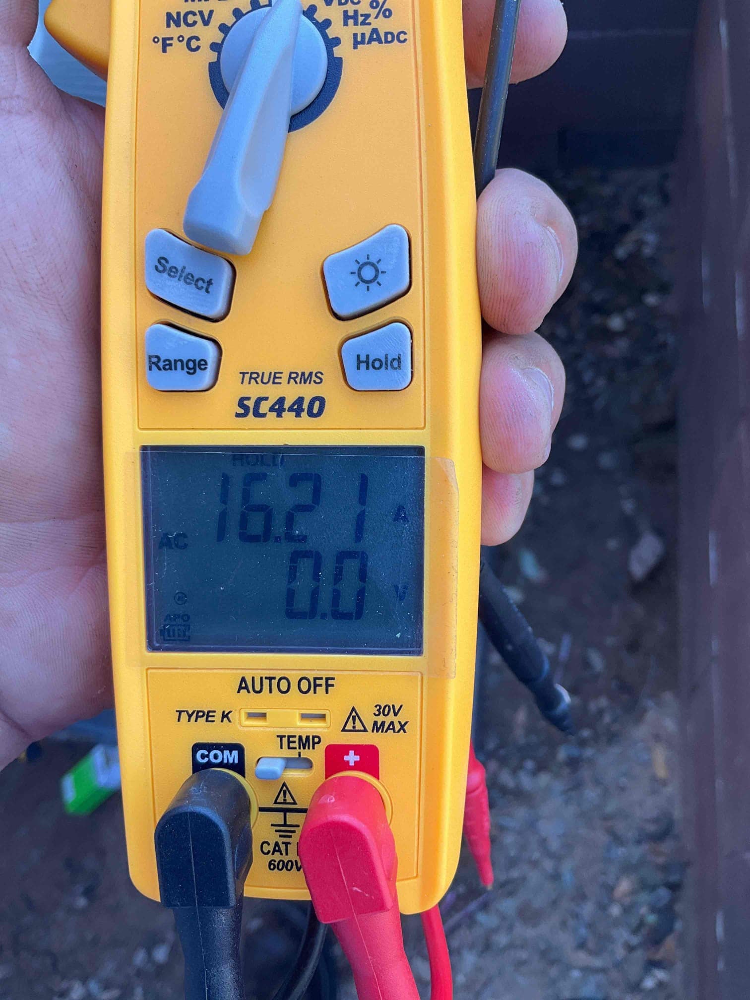 HVAC diagnostic instrument photographed during the service visit.