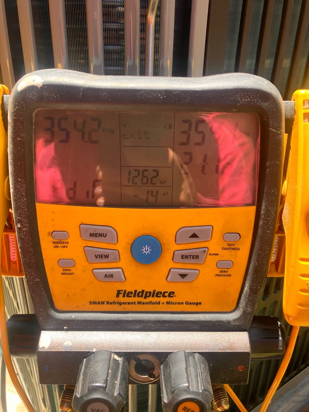 Digital manifold shows equal pressures around 354 PSI on both sides, documenting a nitrogen pressure test on the new system.