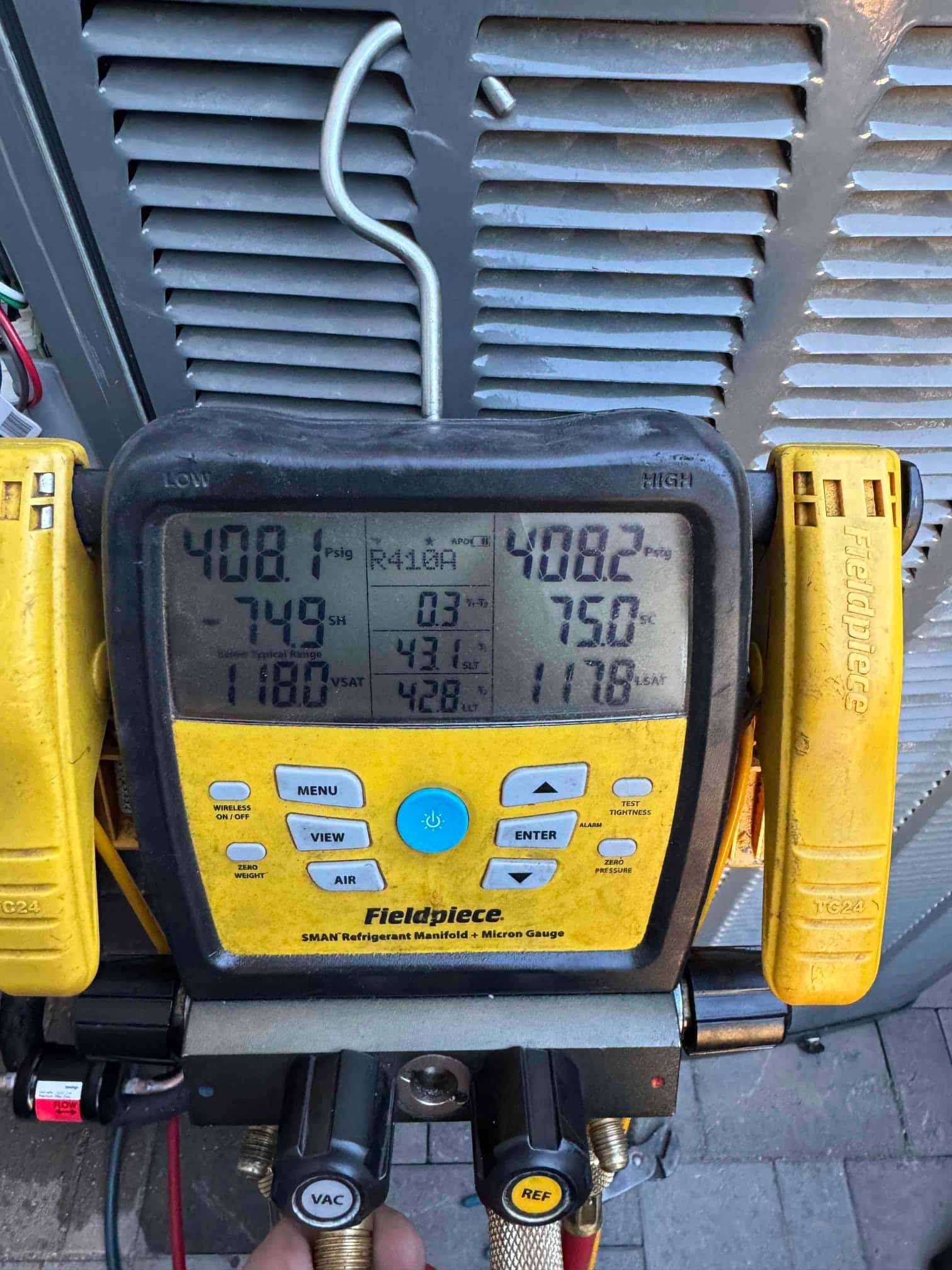 Digital manifold shows equal pressures around 408 PSI on both sides during a nitrogen pressure test of the new system.