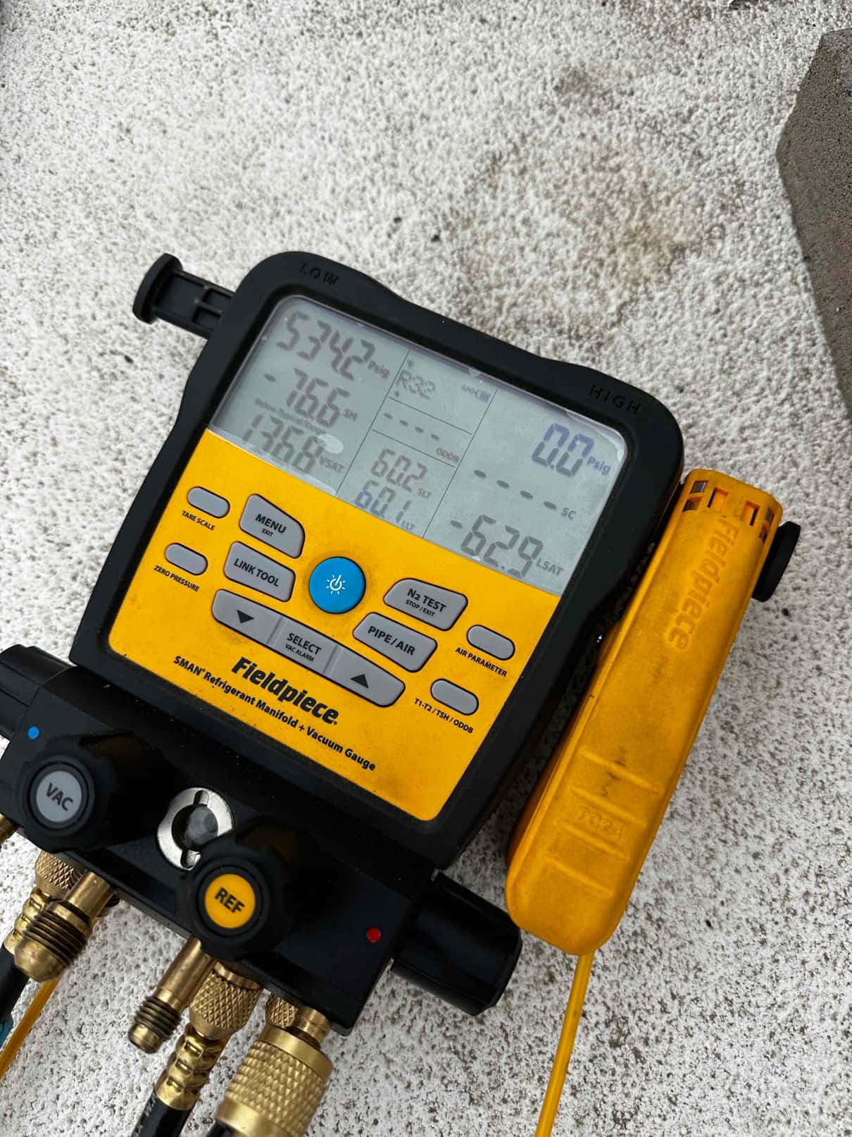 Digital manifold shows both high and low sides equalized during a nitrogen pressure test on the new system.