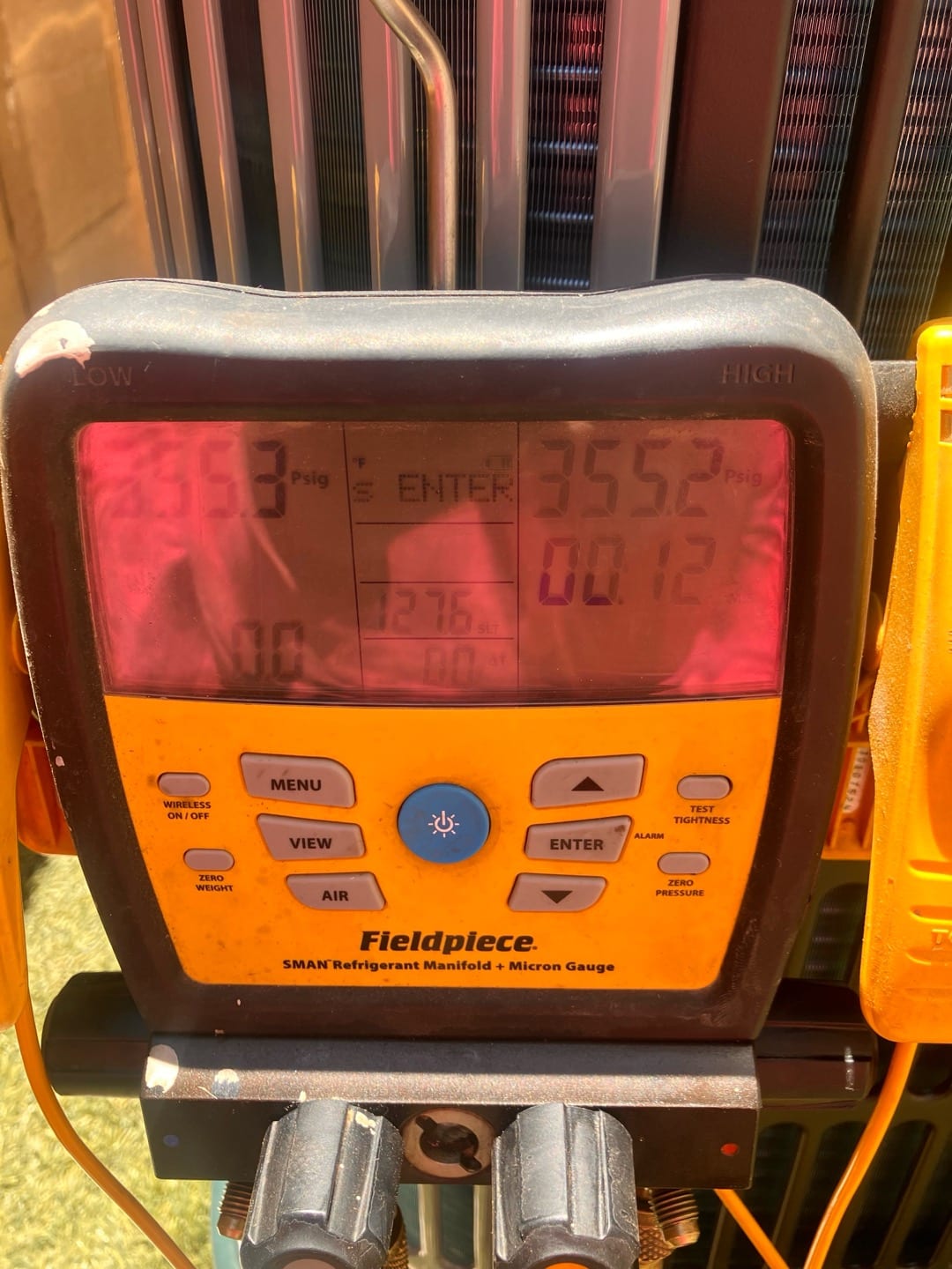 Digital manifold shows both high and low sides holding around 355 PSI during a nitrogen pressure test on the new system.