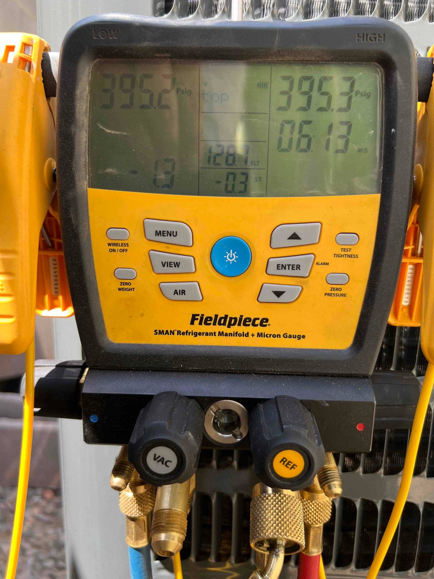 Digital manifold shows both high and low sides holding 395 PSI during a nitrogen pressure test of the new system.