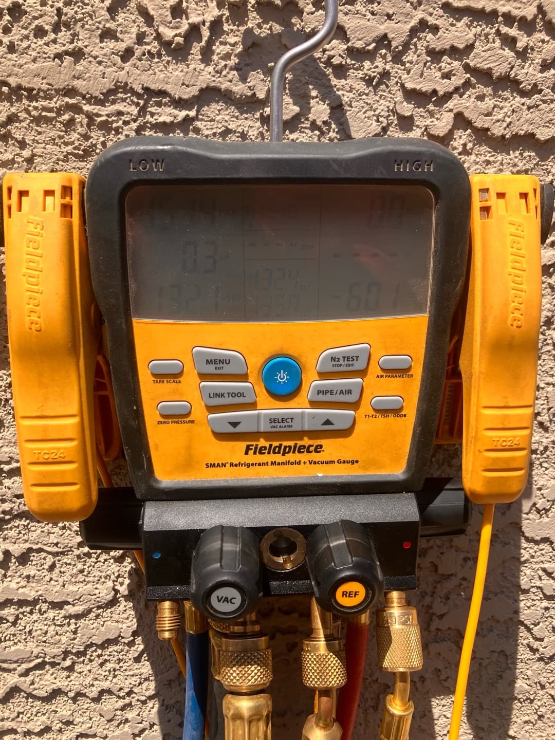 Digital manifold shows both high and low sides equalized during a nitrogen pressure test on the newly installed system.