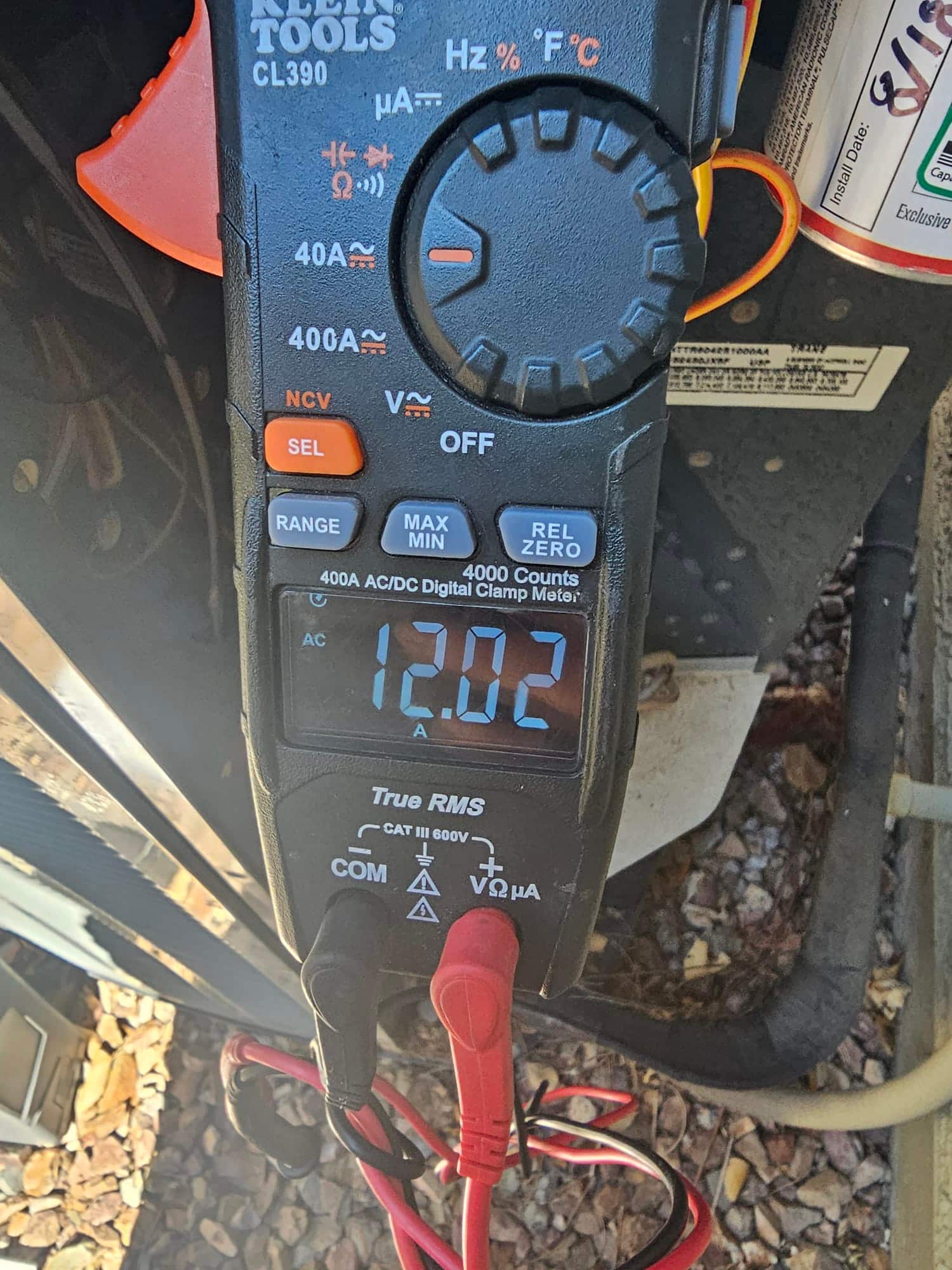 Diagnostic instrument display shows 12.02 A.