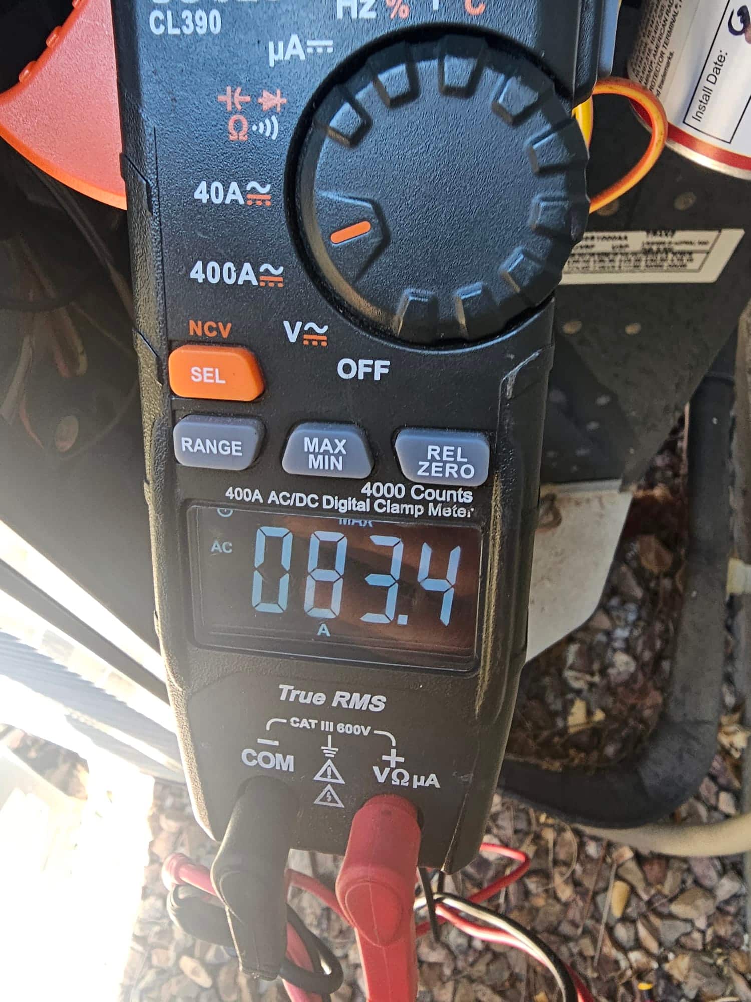 Diagnostic instrument display shows 83.4 A.