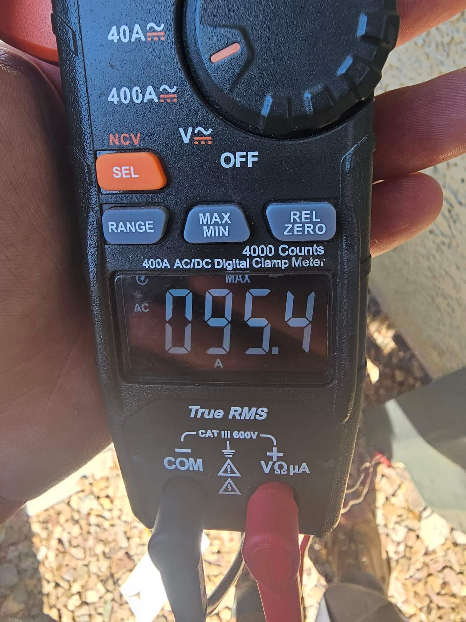 Diagnostic instrument display shows 95.4 A.