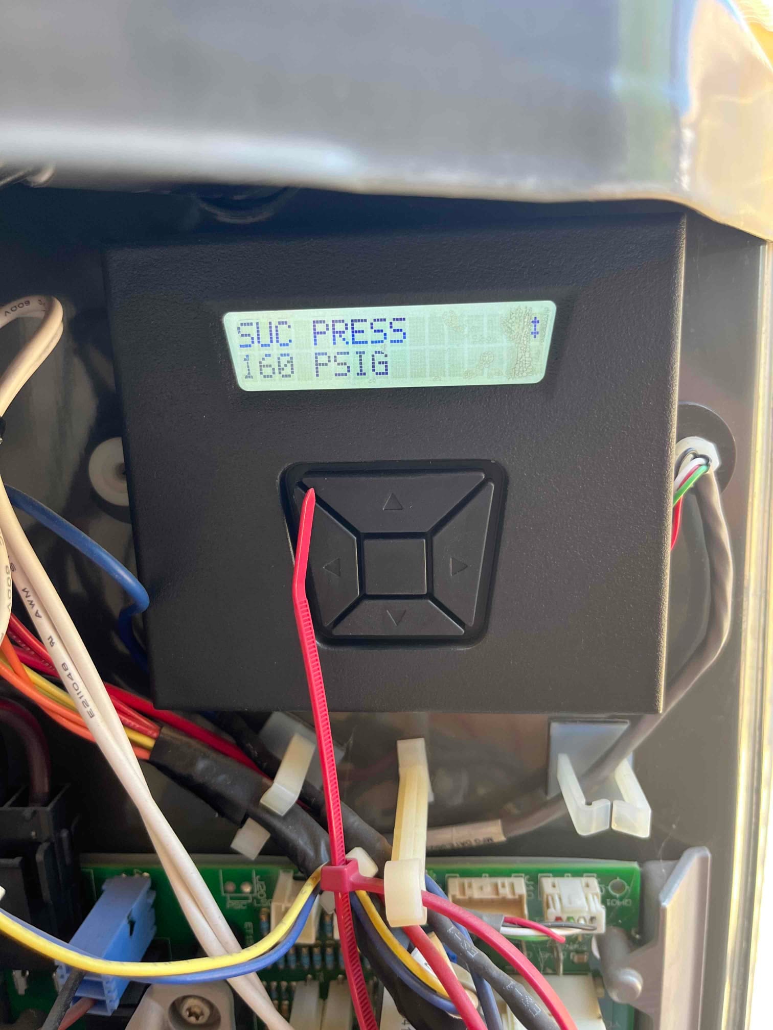 Equipment control module inside the condenser cabinet displays SUC PRESS 160 PSIG, with wiring harnesses and zip ties visible.