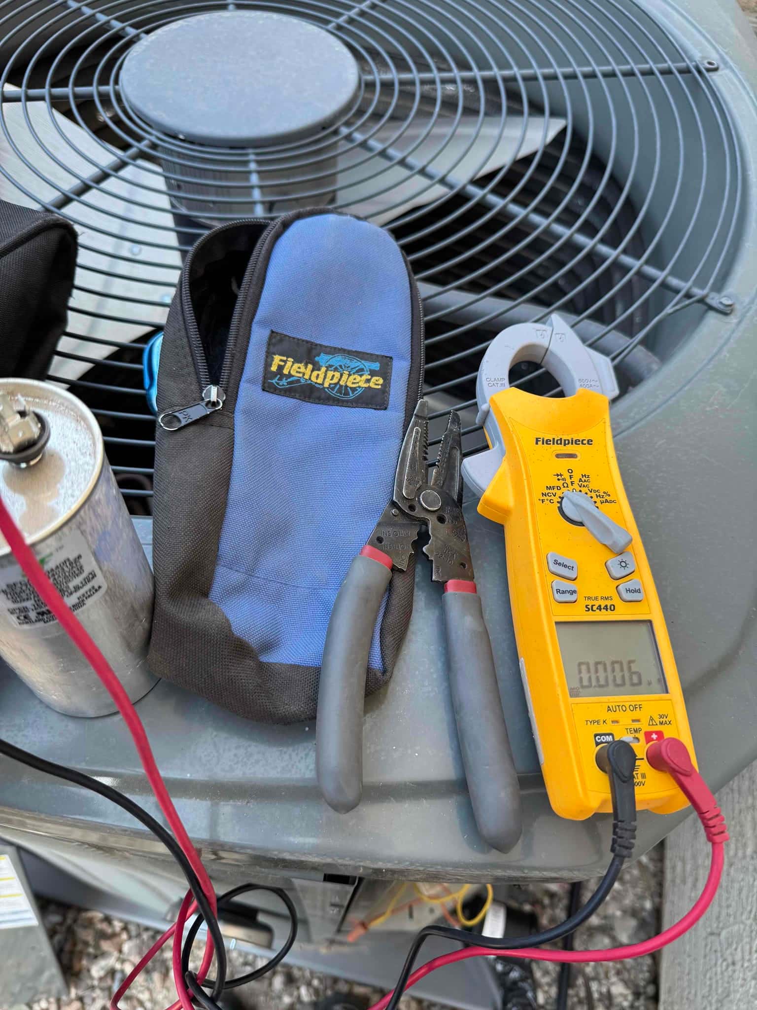 HVAC diagnostic instrument photographed during the service visit.