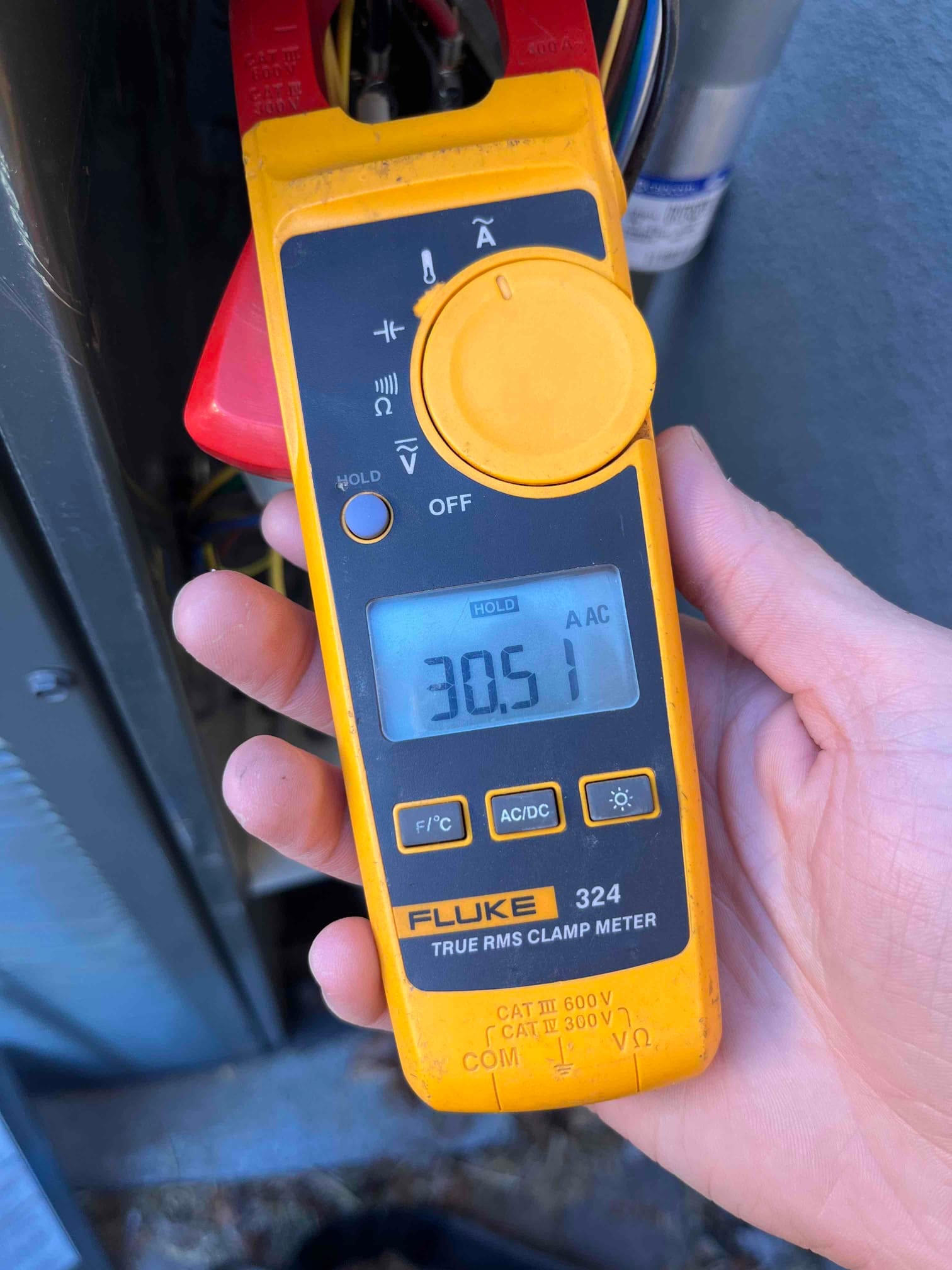 HVAC diagnostic instrument photographed during the service visit.
