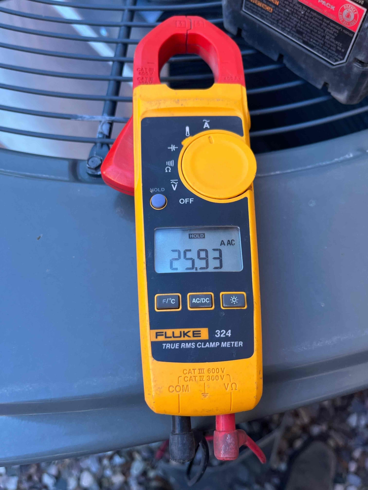 HVAC diagnostic instrument photographed during the service visit.