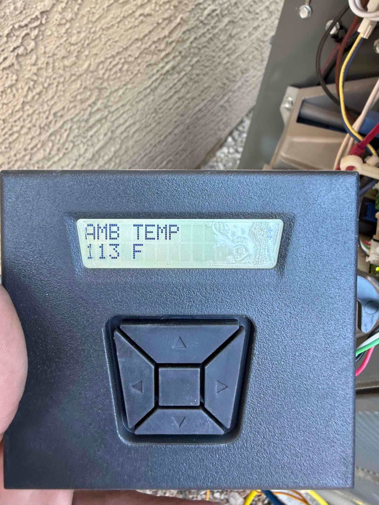 HVAC diagnostic instrument photographed during the service visit.