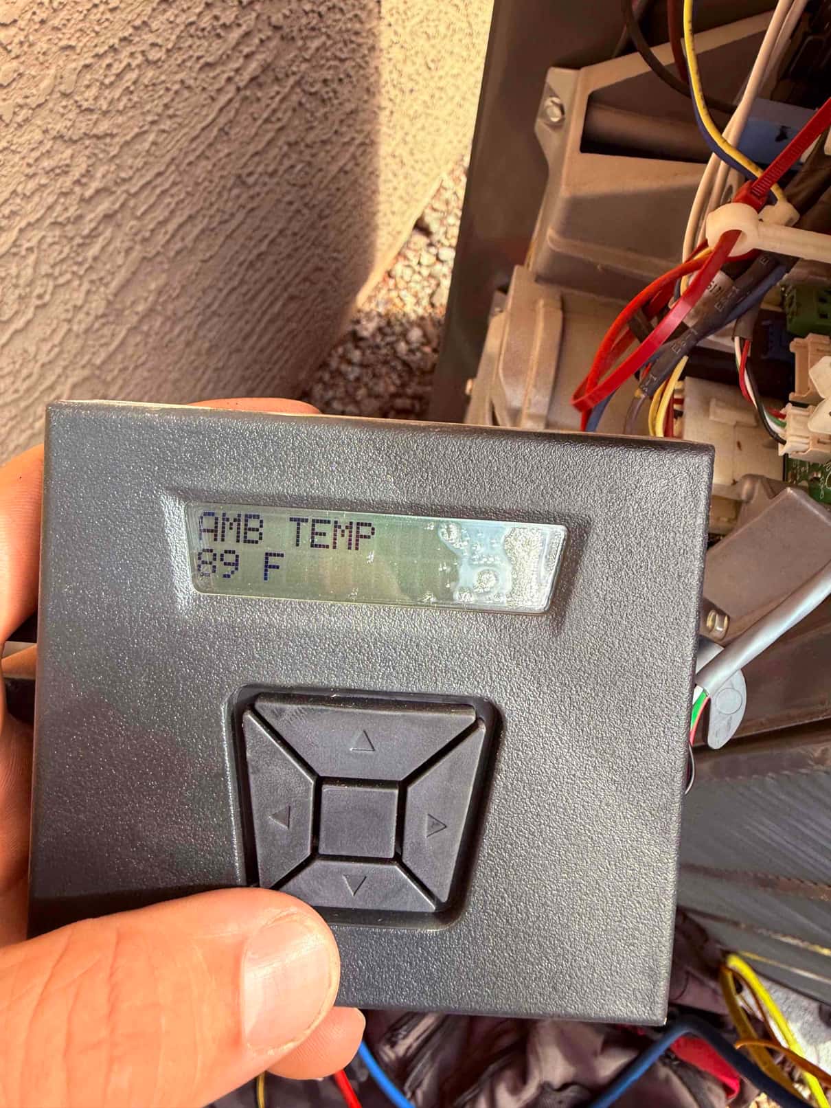 HVAC diagnostic instrument photographed during the service visit.