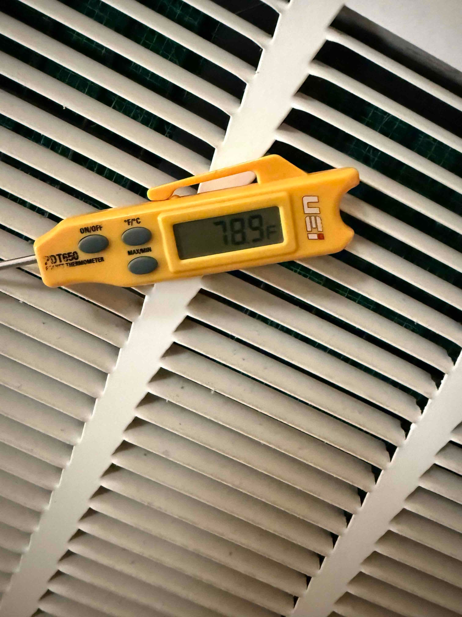 HVAC diagnostic instrument photographed during the service visit.