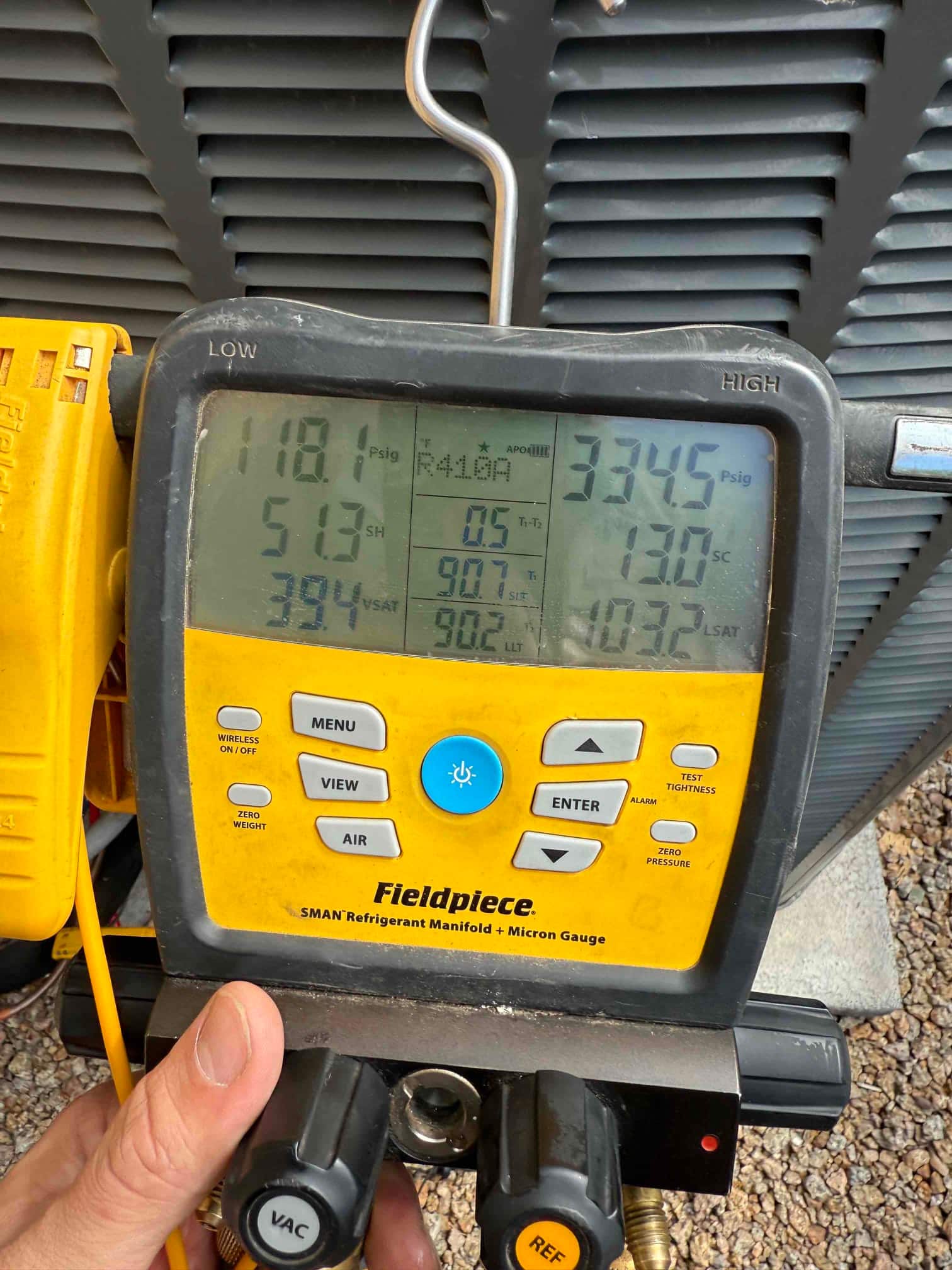 HVAC diagnostic instrument photographed during the service visit.