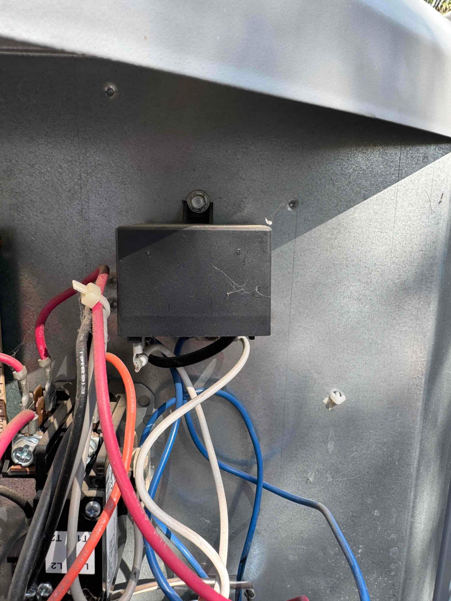 Contactor with labeled L1 and L2 terminals and a black control module with connected red, blue, white wiring.