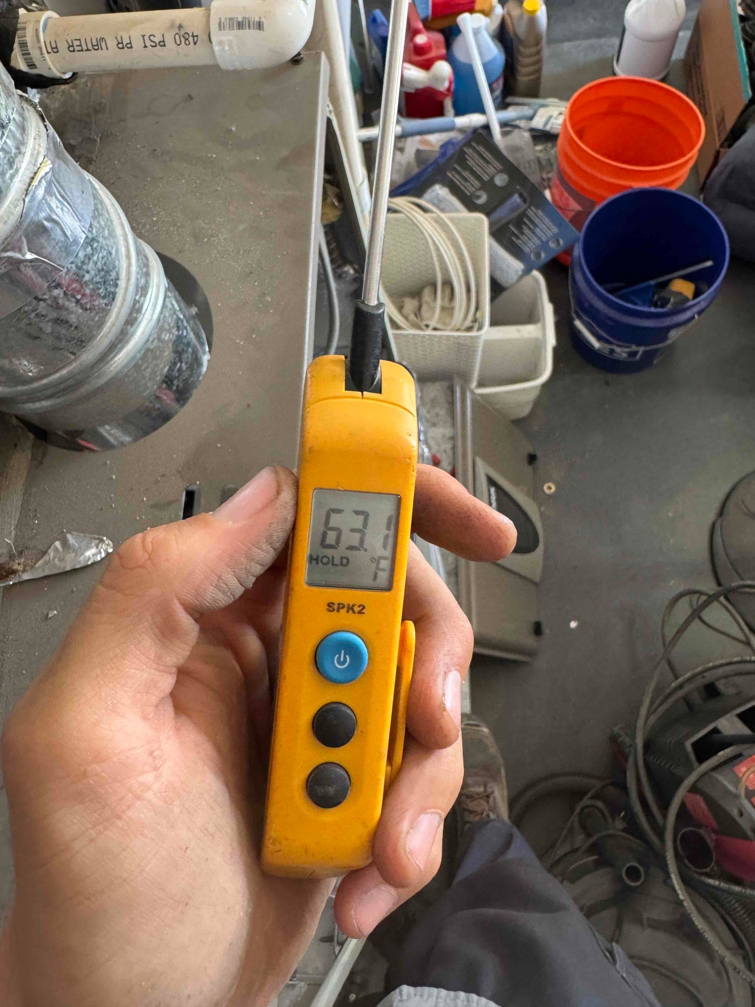 Diagnostic instrument display shows 63.1 °F.