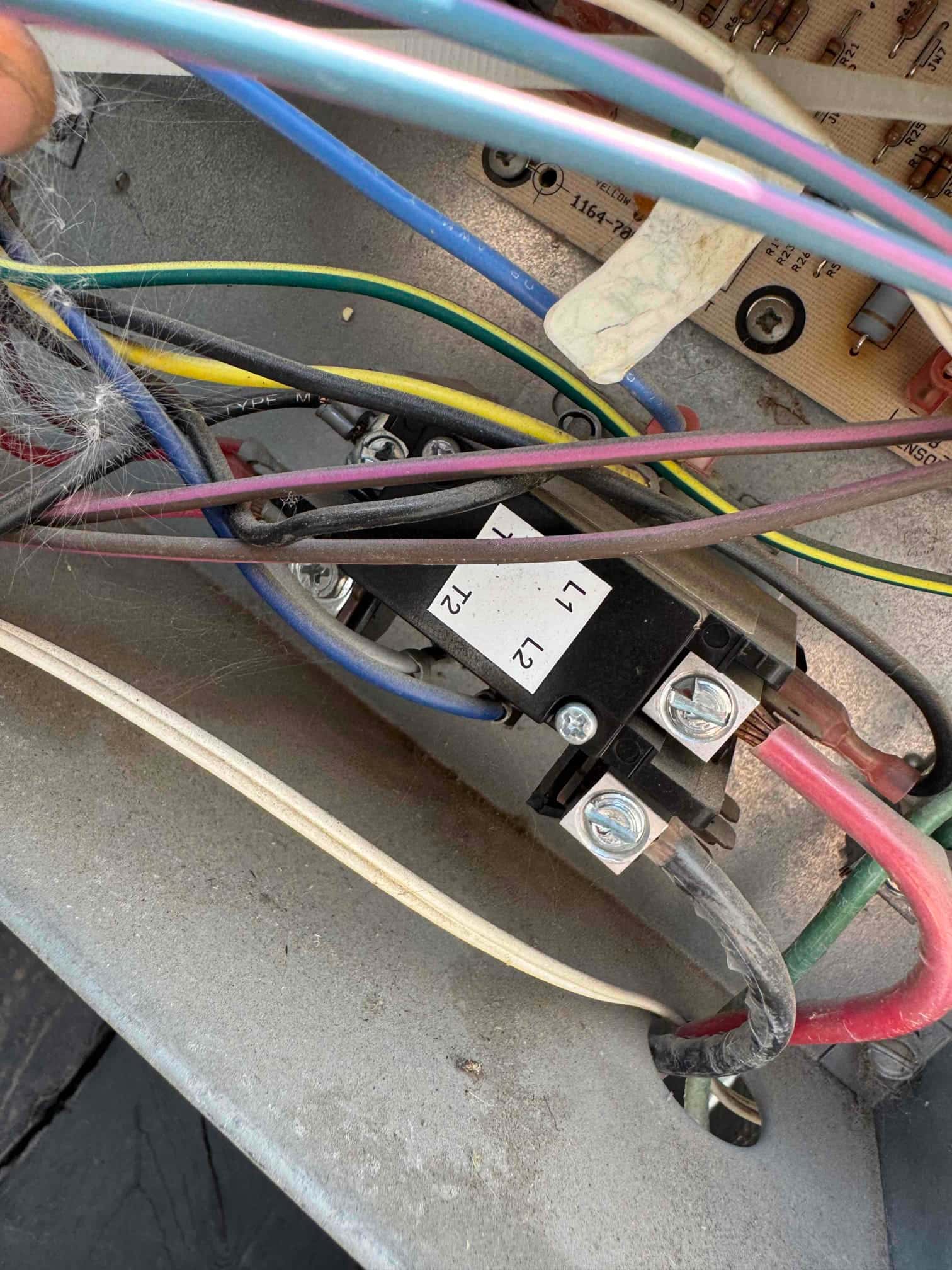 Electrical compartment showing contactor labeled L1 and L2 with connected line and control wiring.