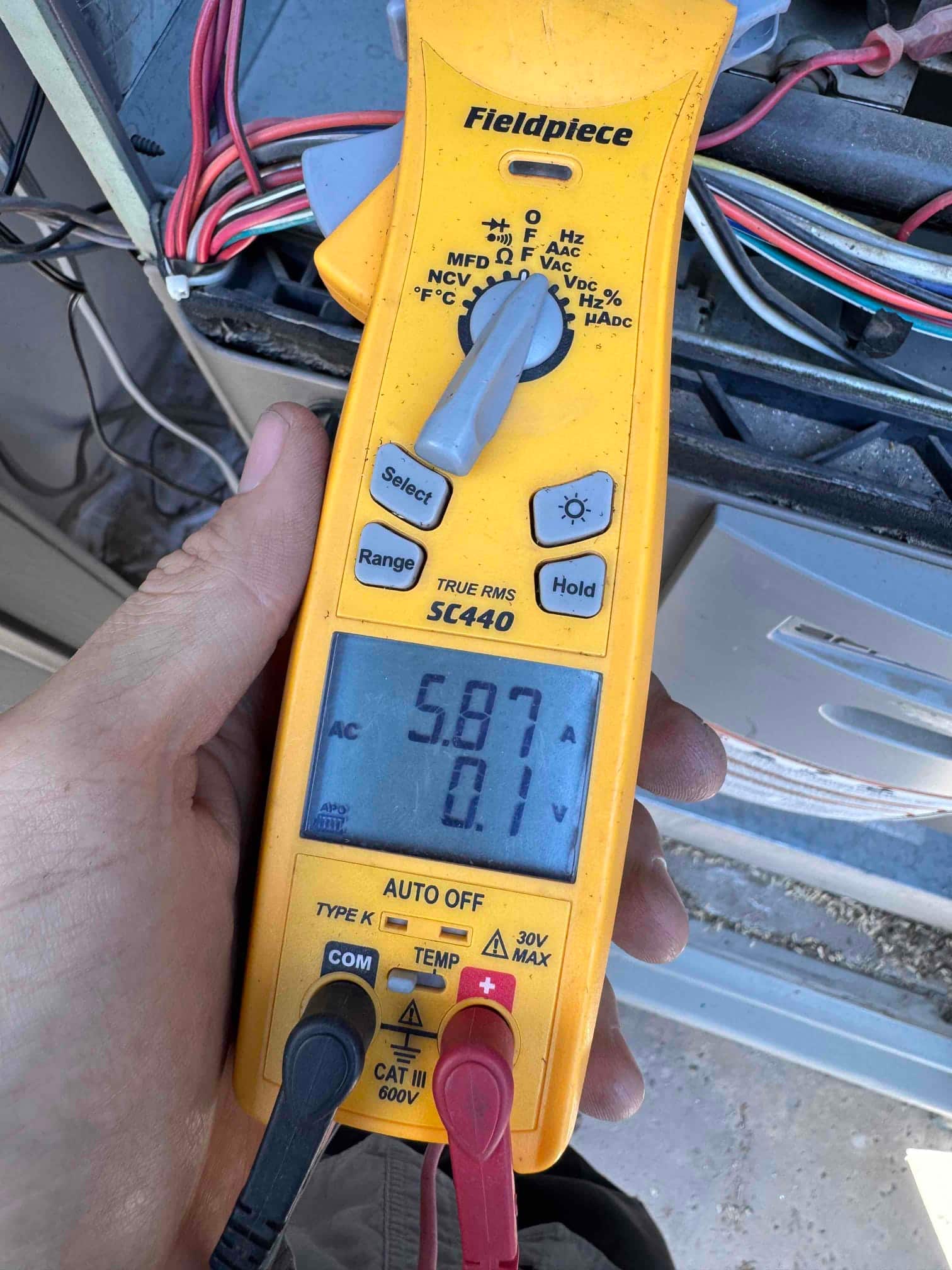 HVAC diagnostic instrument photographed during the service visit.
