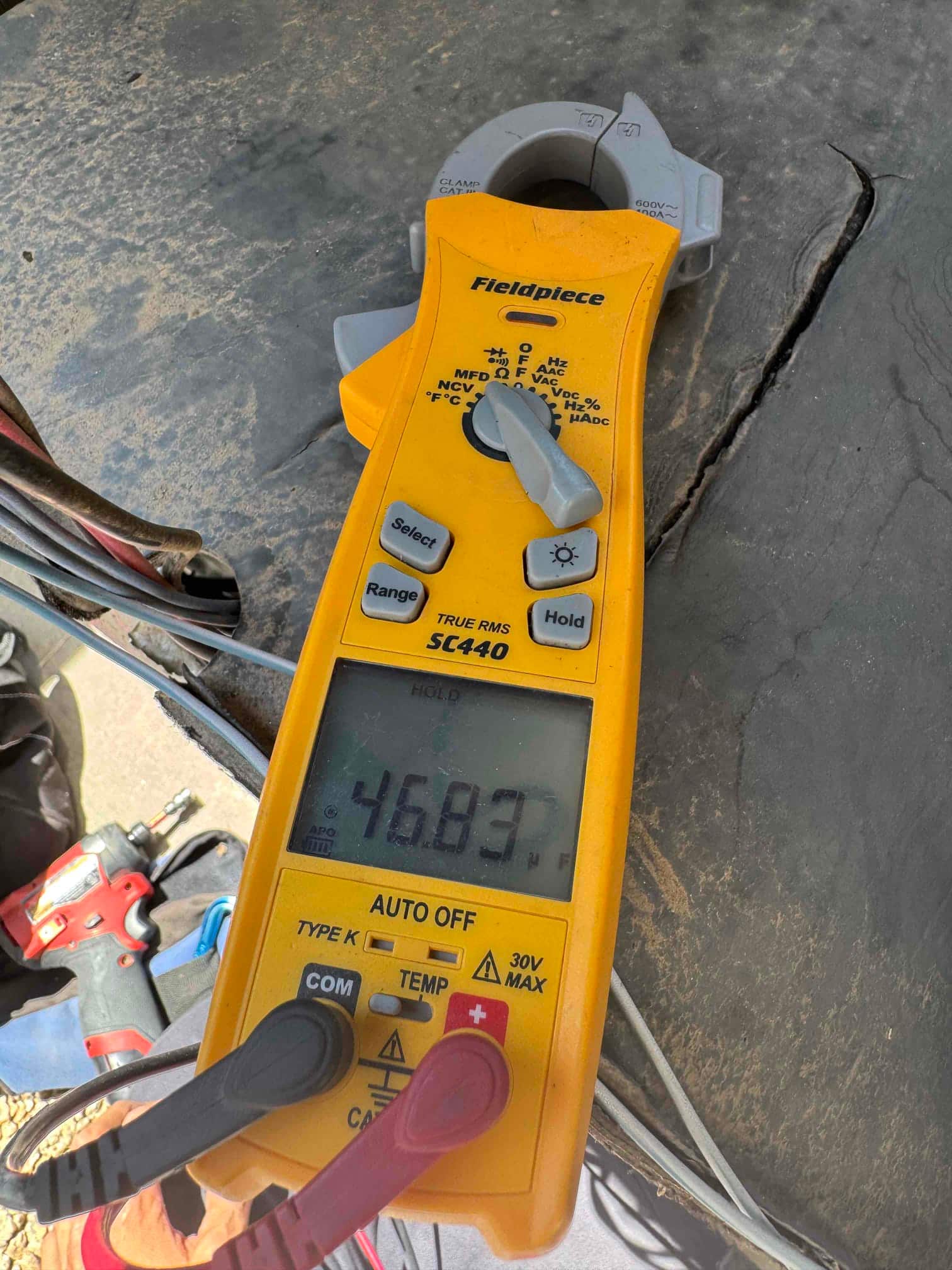 HVAC diagnostic instrument photographed during the service visit.