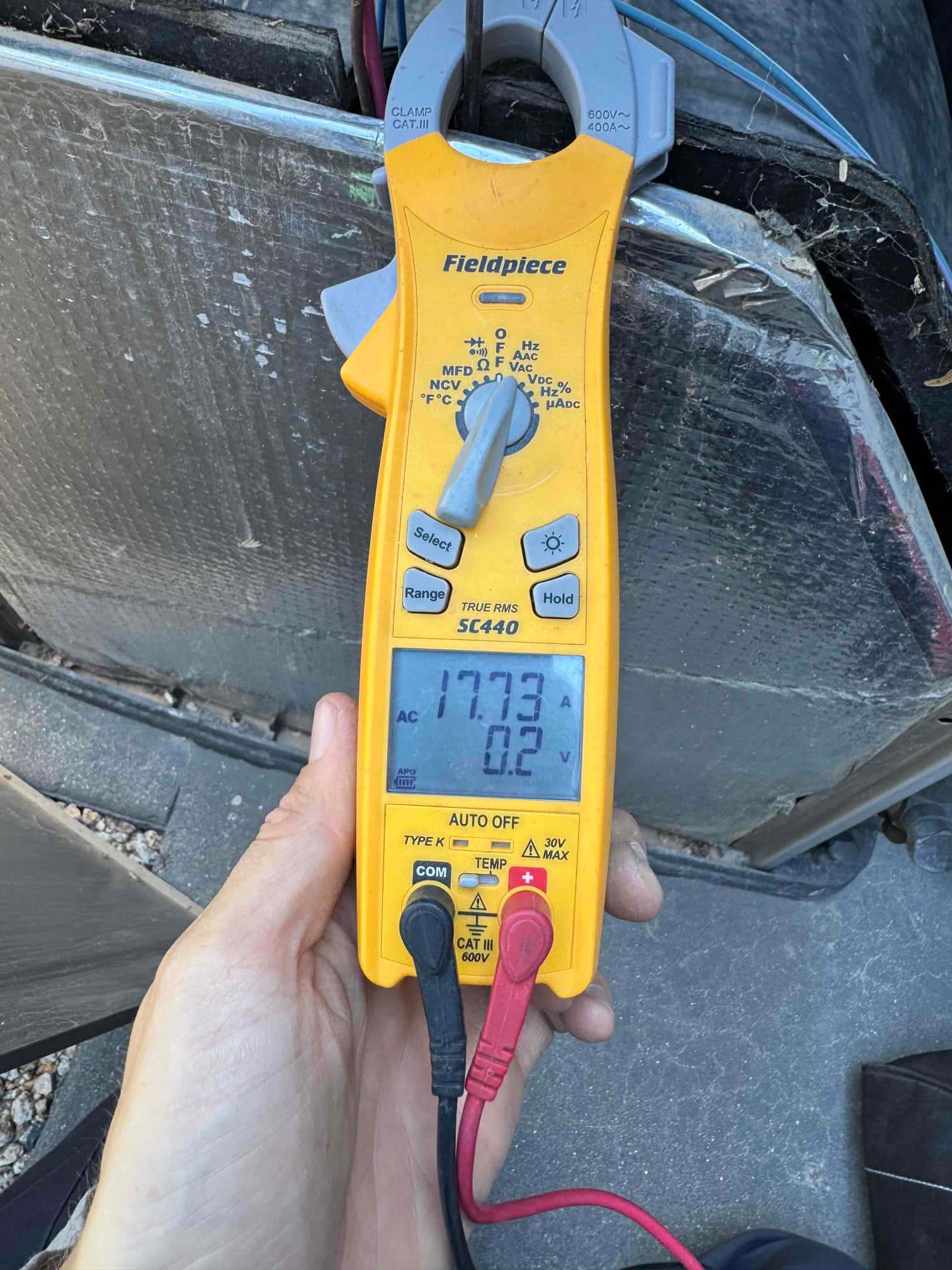 HVAC diagnostic instrument photographed during the service visit.