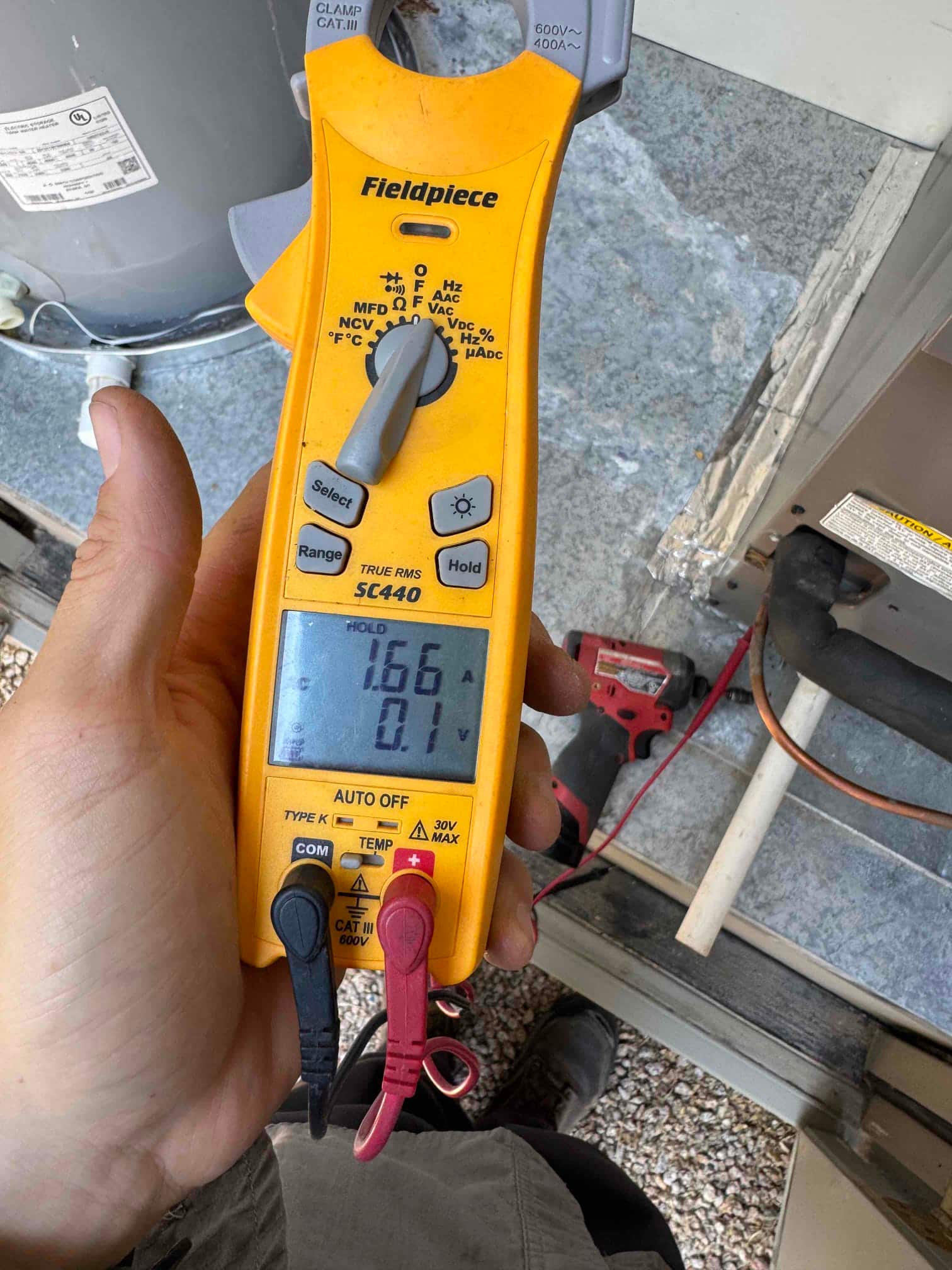 HVAC diagnostic instrument photographed during the service visit.
