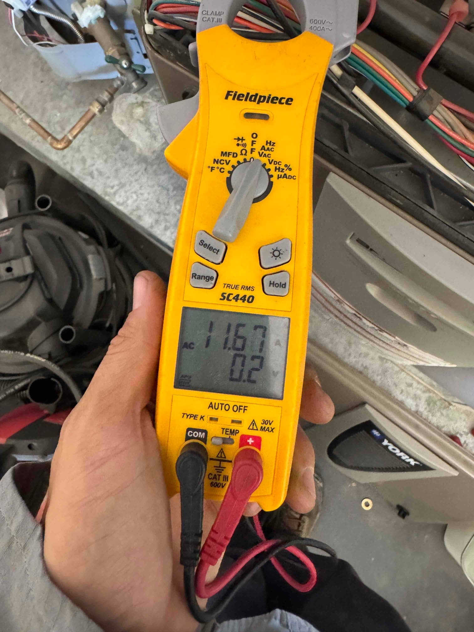 HVAC diagnostic instrument photographed during the service visit.