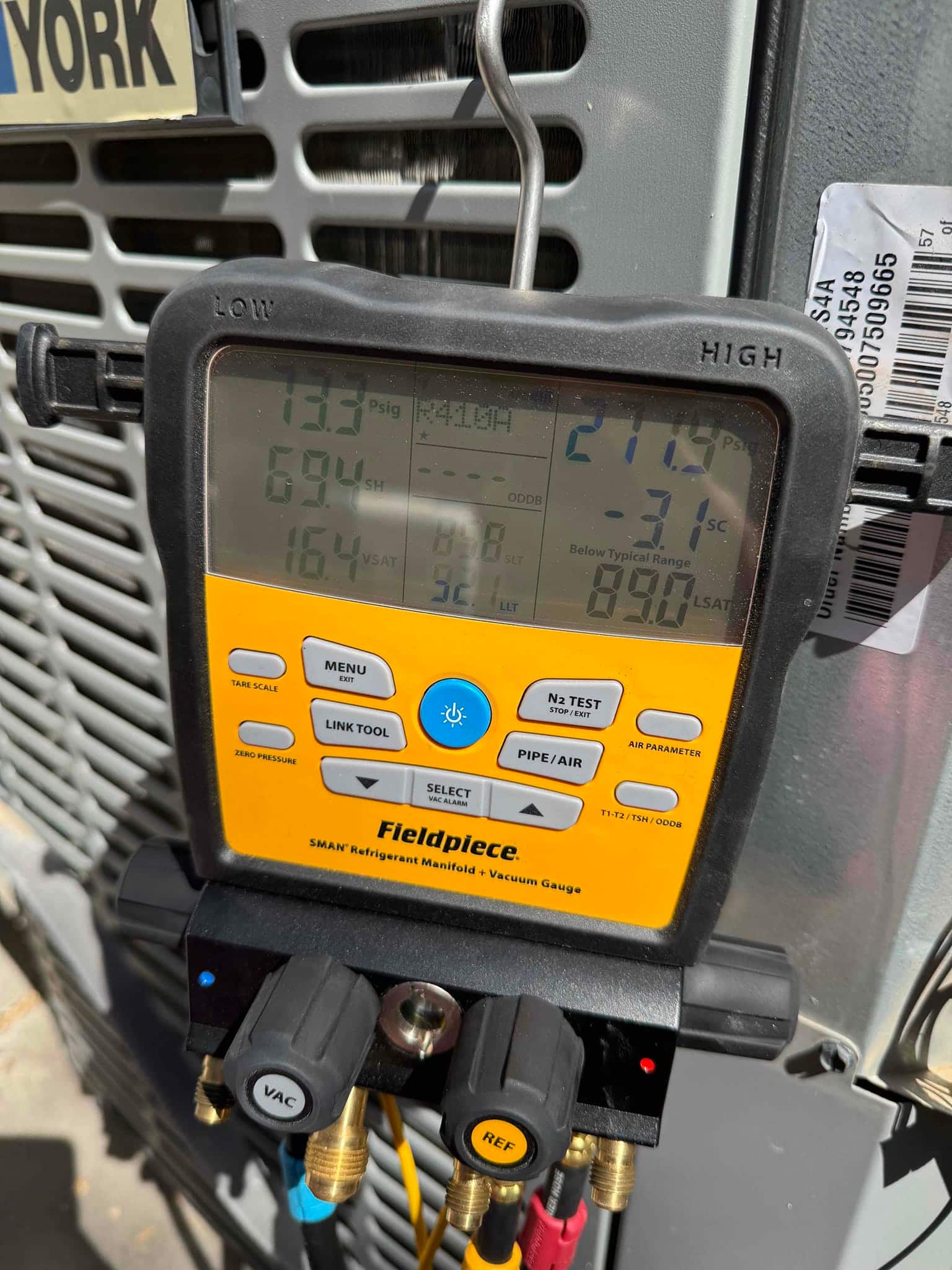 HVAC diagnostic instrument photographed during the service visit.