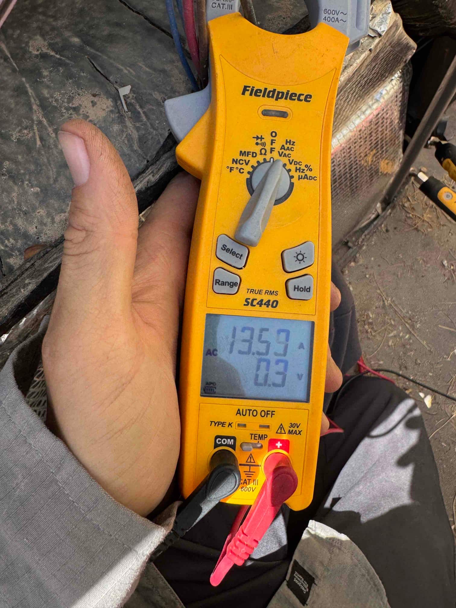 HVAC diagnostic instrument photographed during the service visit.
