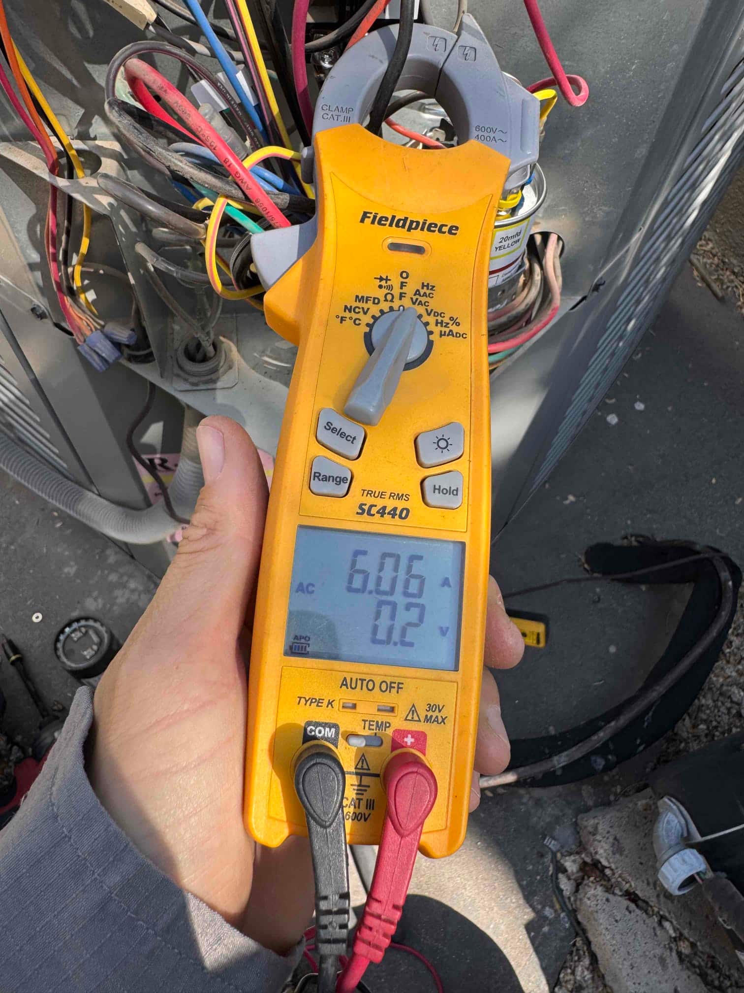 HVAC diagnostic instrument photographed during the service visit.