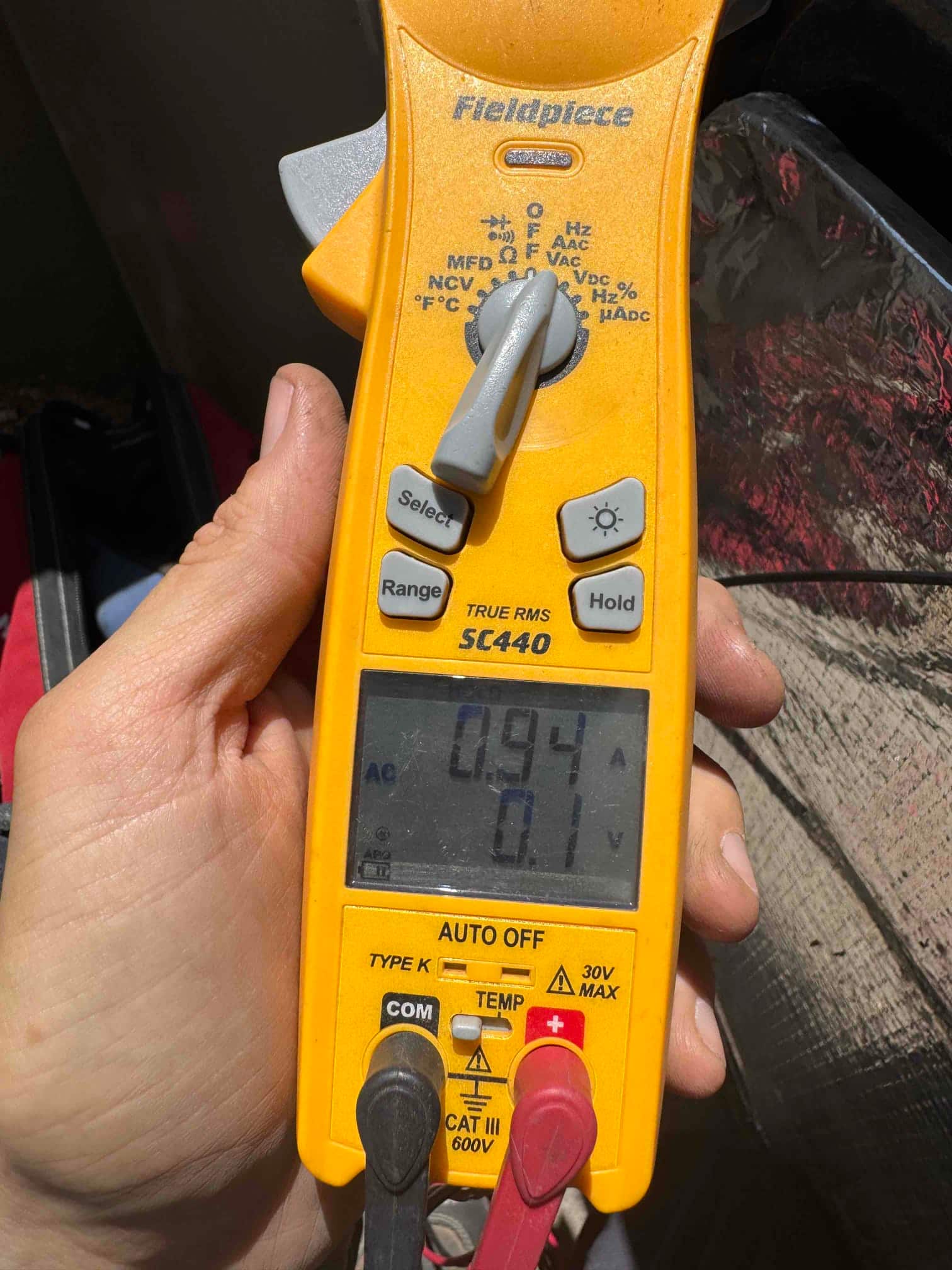 HVAC diagnostic instrument photographed during the service visit.