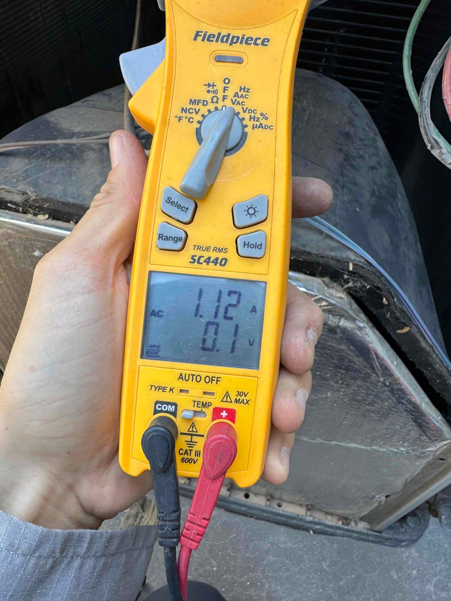 HVAC diagnostic instrument photographed during the service visit.