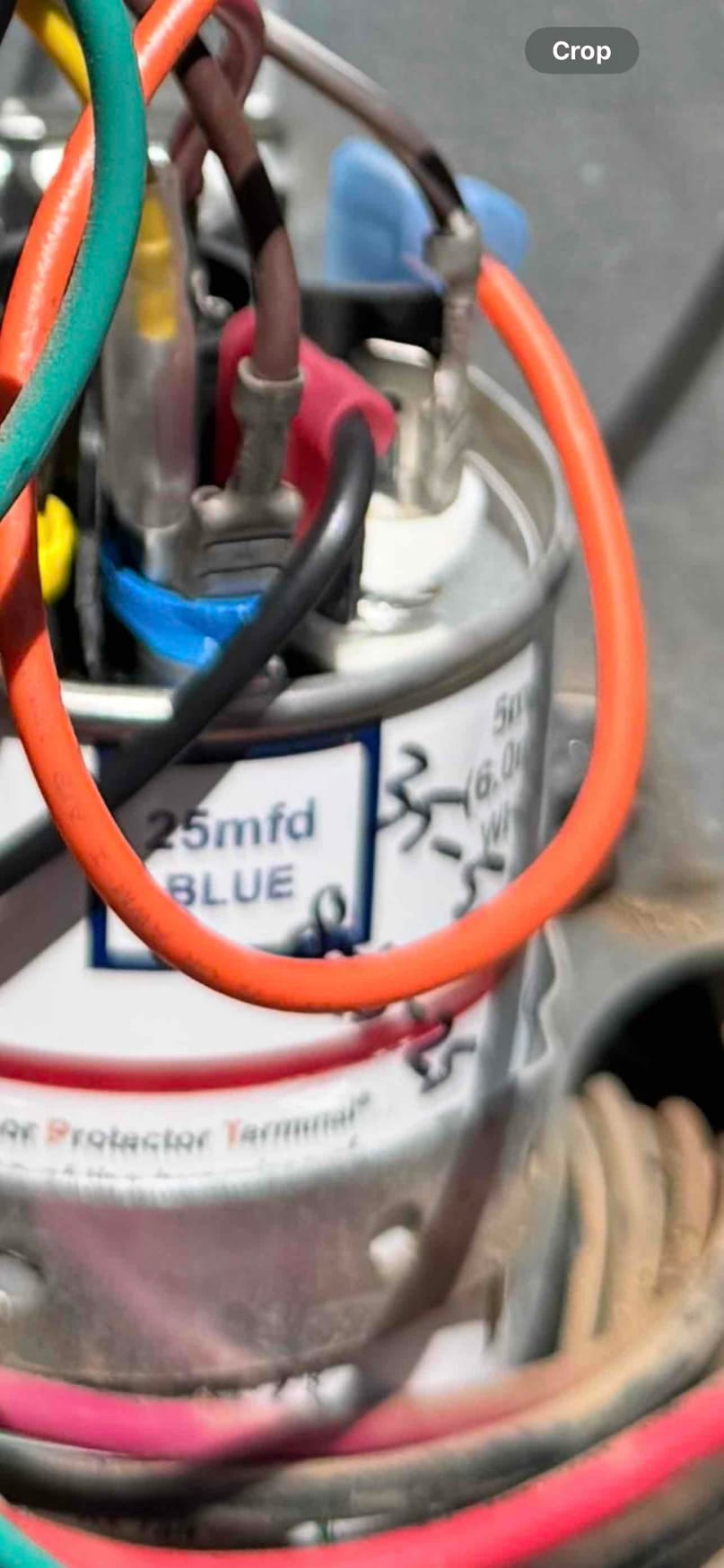 Run capacitor labeled 25 mfd BLUE with multiple wires connected to its terminals.