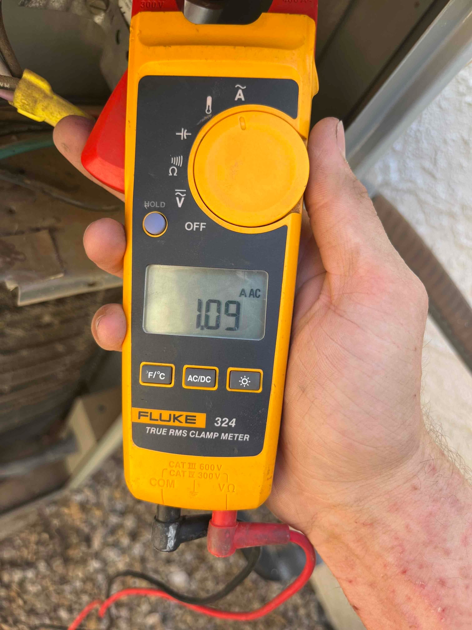 Diagnostic instrument display shows 1.09 A.