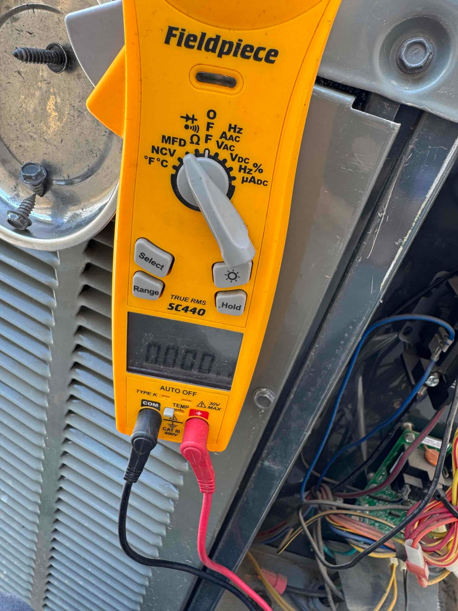 HVAC diagnostic instrument photographed during the service visit.