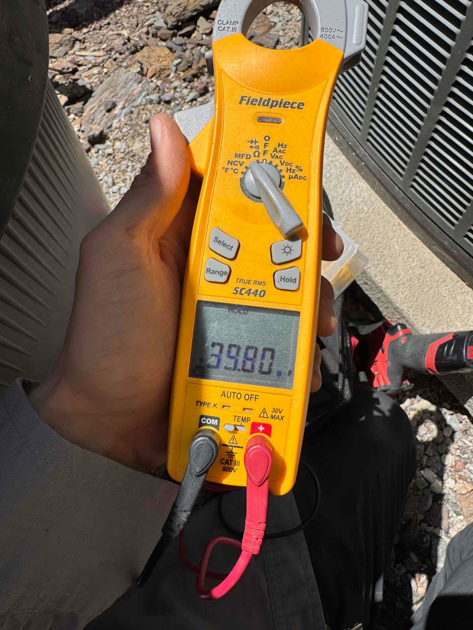 HVAC diagnostic instrument photographed during the service visit.