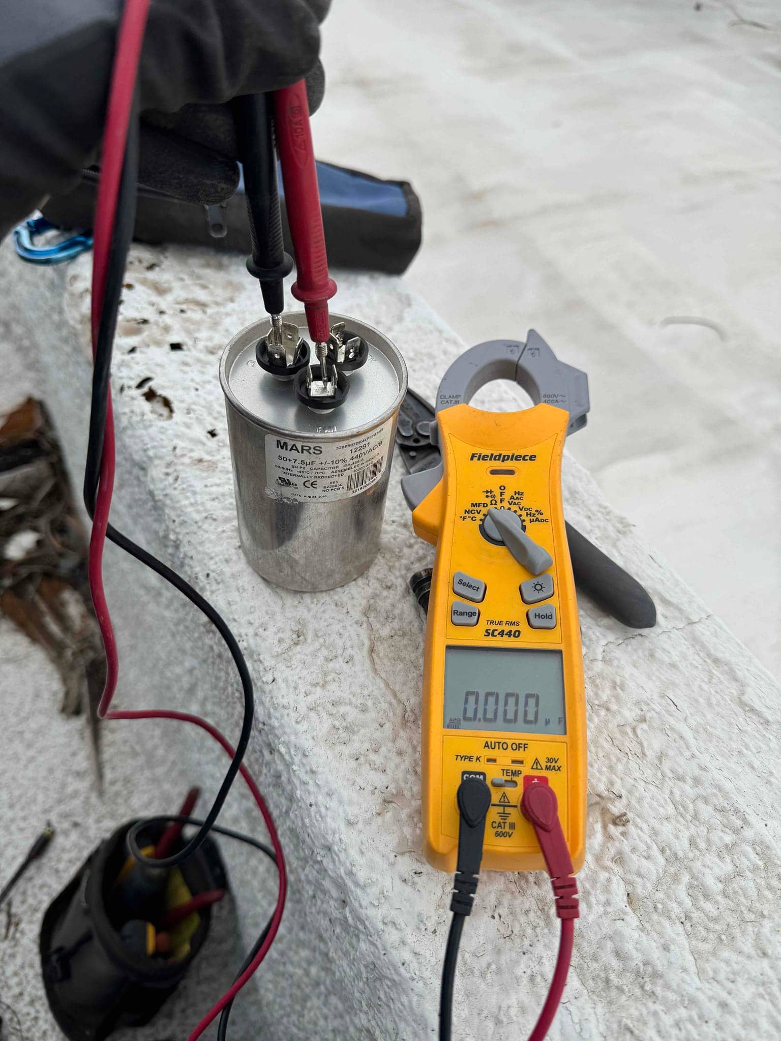 HVAC diagnostic instrument photographed during the service visit.