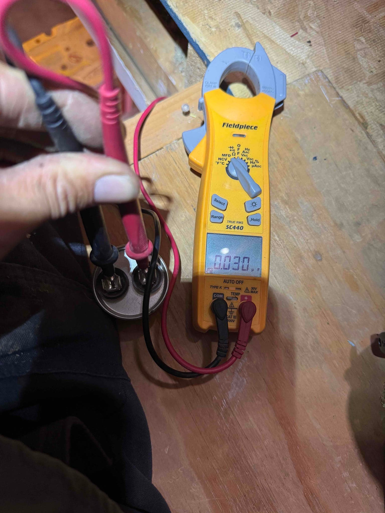HVAC diagnostic instrument photographed during the service visit.