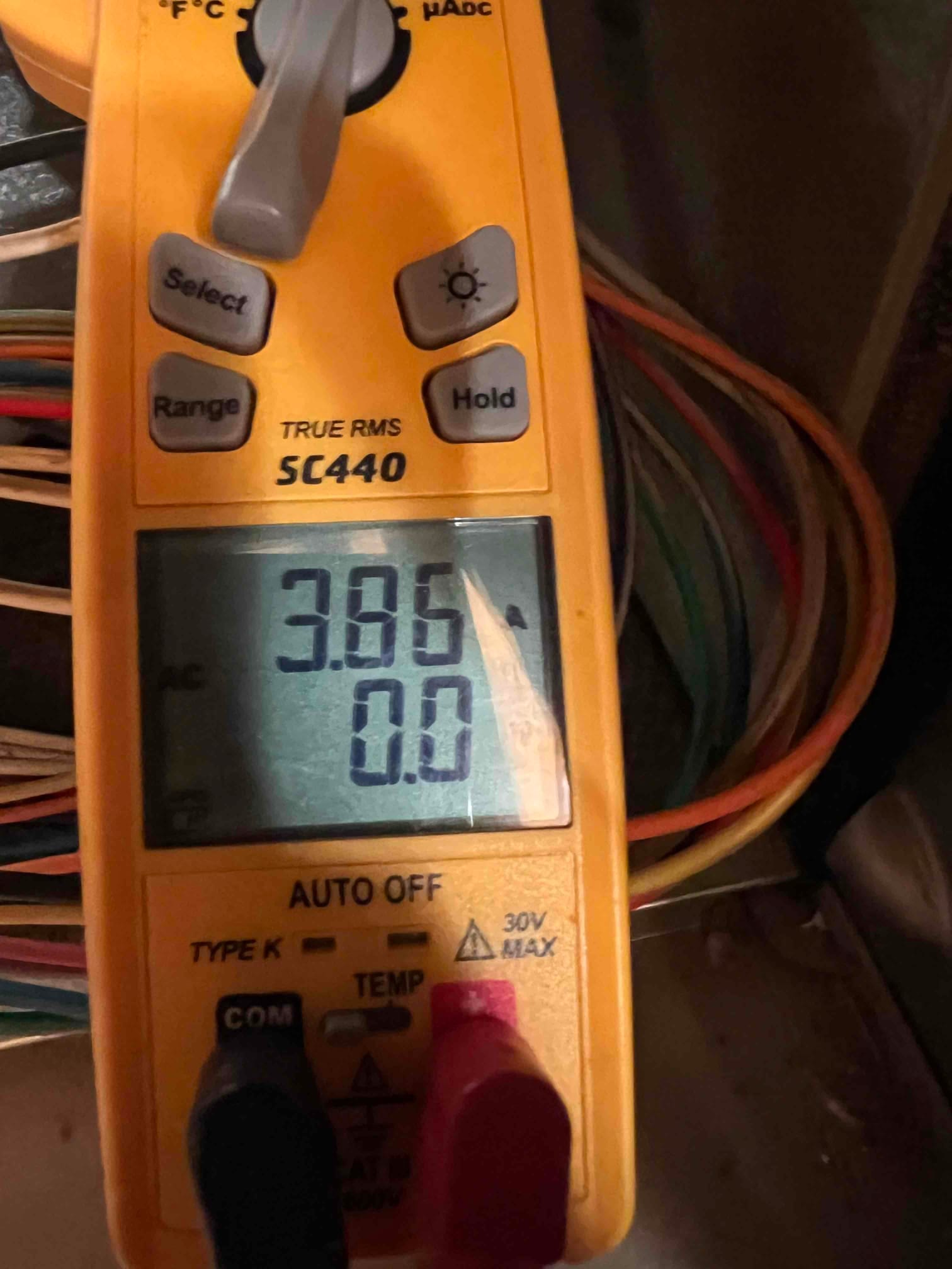 HVAC diagnostic instrument photographed during the service visit.