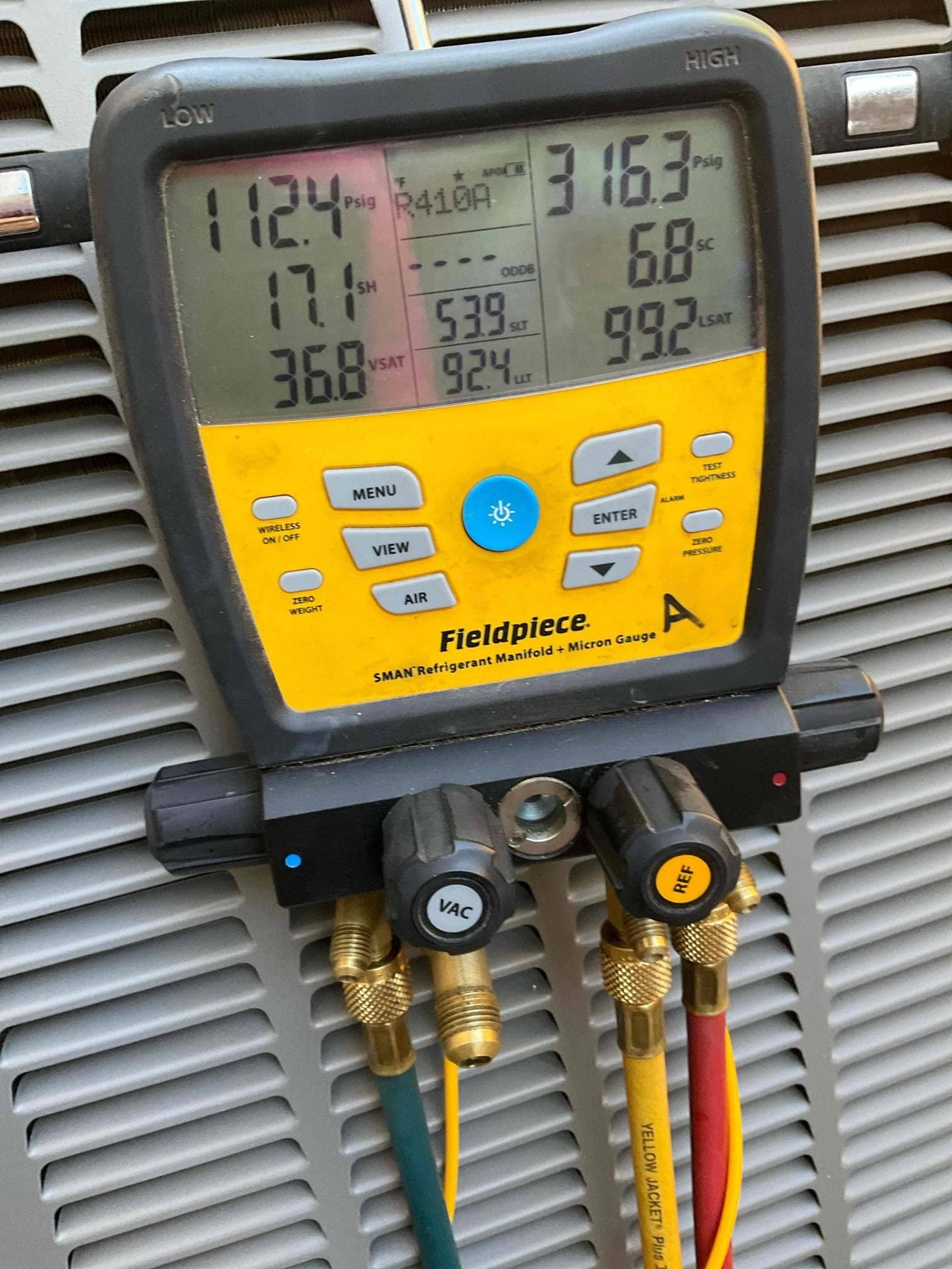 HVAC diagnostic instrument photographed during the service visit.
