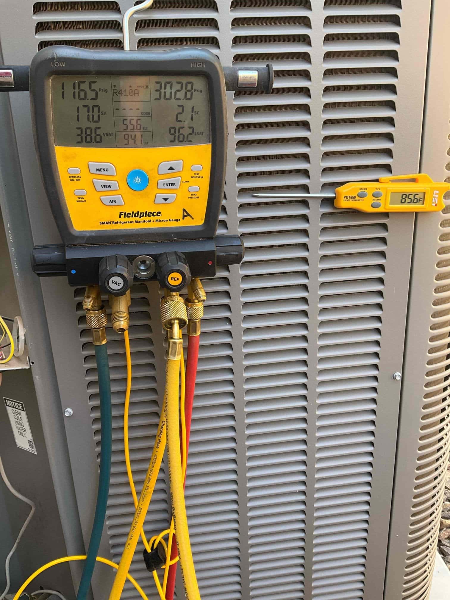 HVAC diagnostic instrument photographed during the service visit.