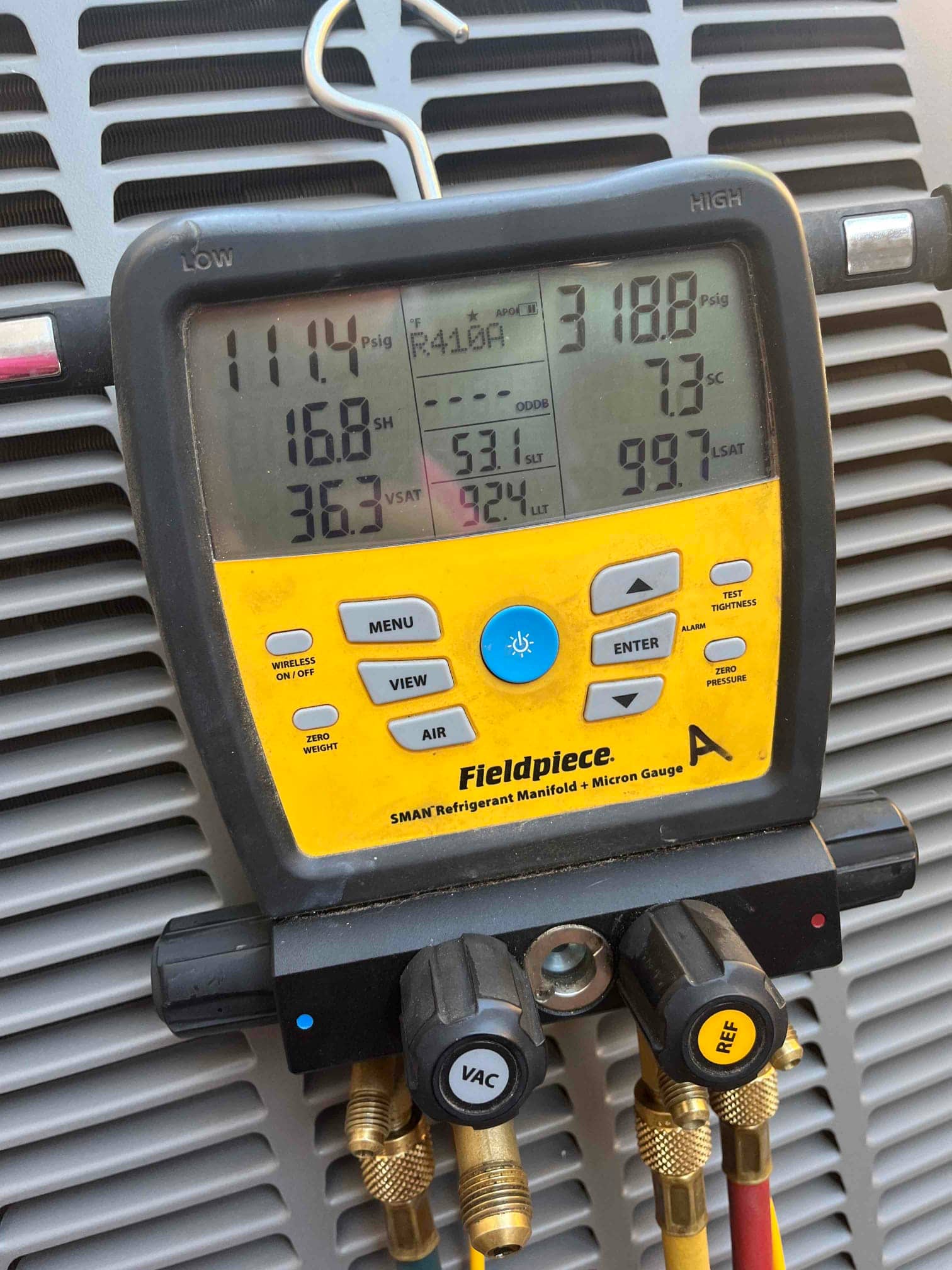HVAC diagnostic instrument photographed during the service visit.