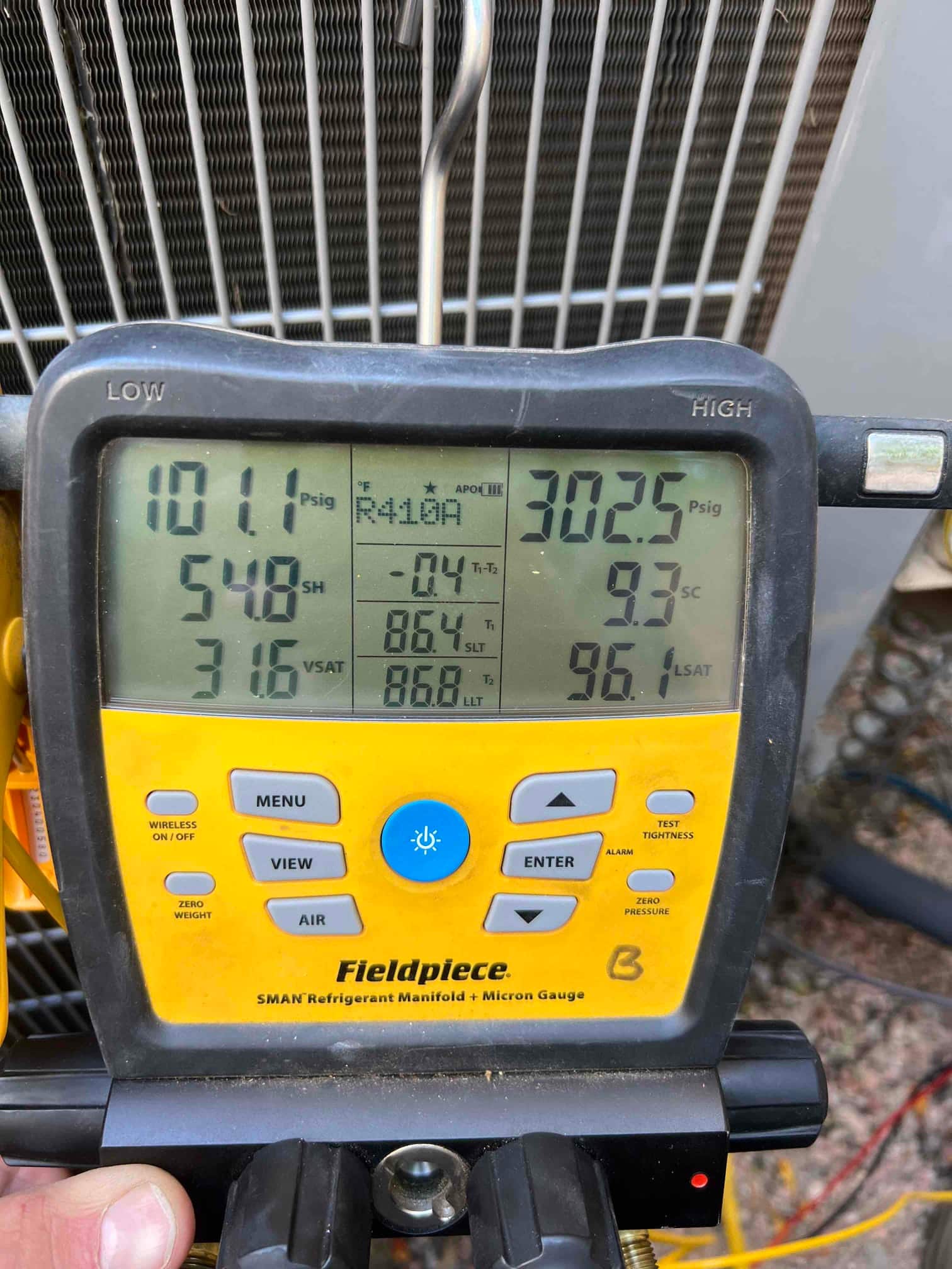 HVAC diagnostic instrument photographed during the service visit.