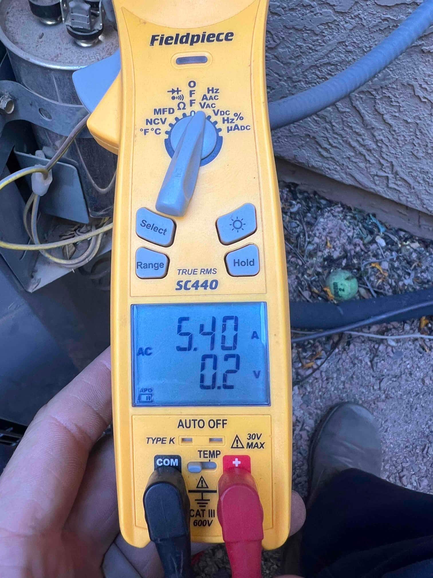 HVAC diagnostic instrument photographed during the service visit.