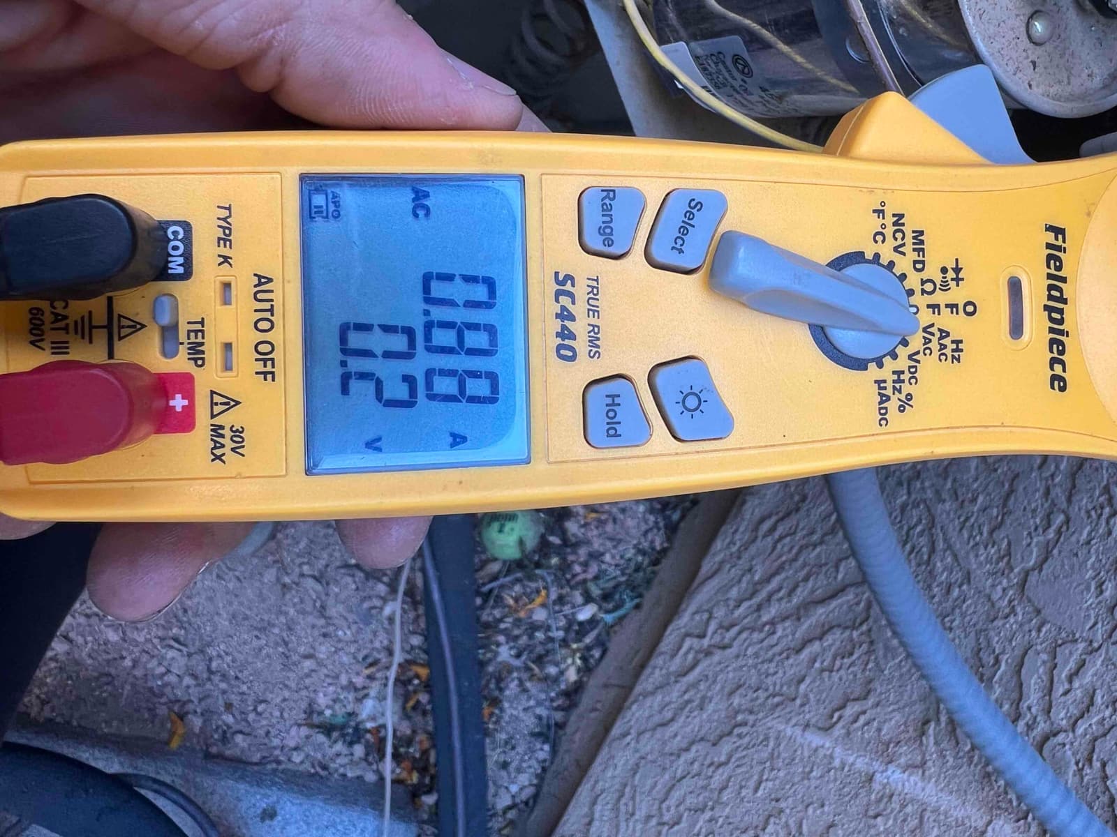 HVAC diagnostic instrument photographed during the service visit.