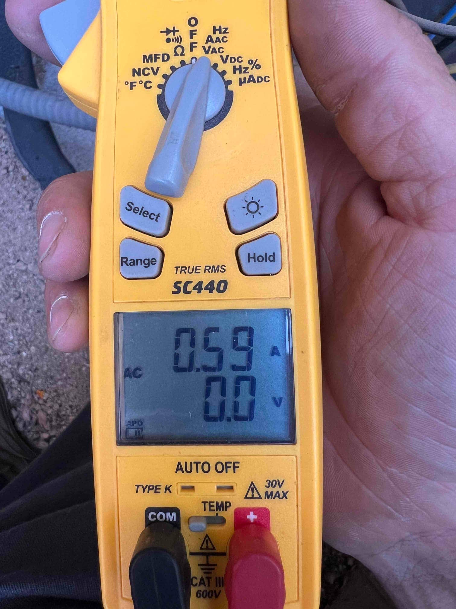 HVAC diagnostic instrument photographed during the service visit.